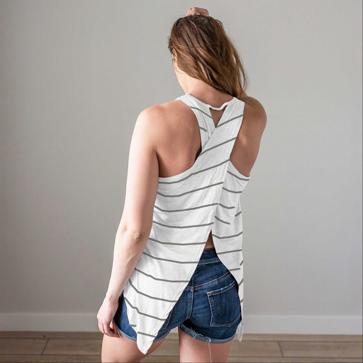 A stylish striped open back tank top featuring a criss-cross design, perfect for spring and summer wear.