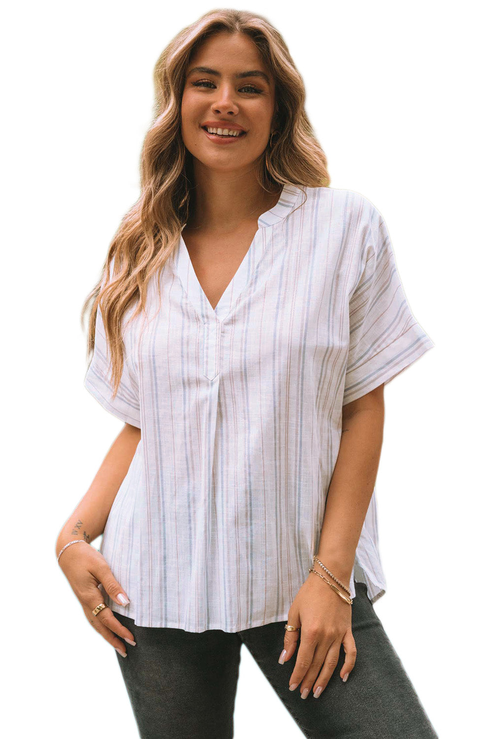 A stylish striped print loose fit top featuring a v-neckline and side slits, perfect for casual wear and layering.