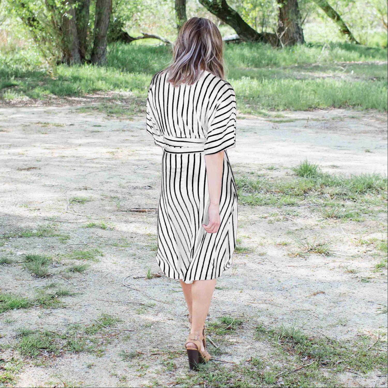 A stylish striped vee neck dress featuring a plunging neckline, self-tie waist, and soft swingy sleeves, perfect for summer outings.