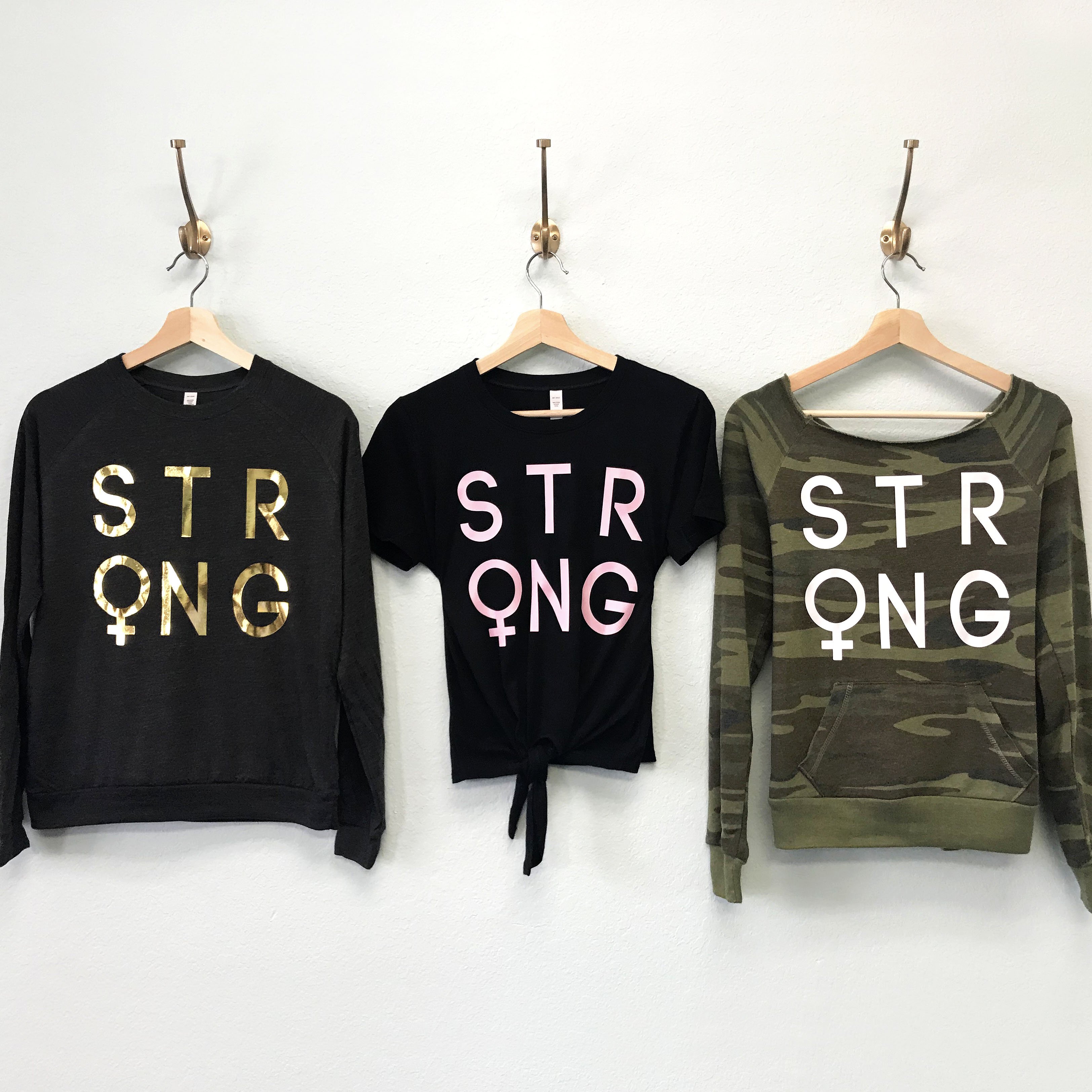 STRONG FEMALE Pick Style collection featuring a long sleeve shirt, crop top, and sweatshirt in various styles and colors.