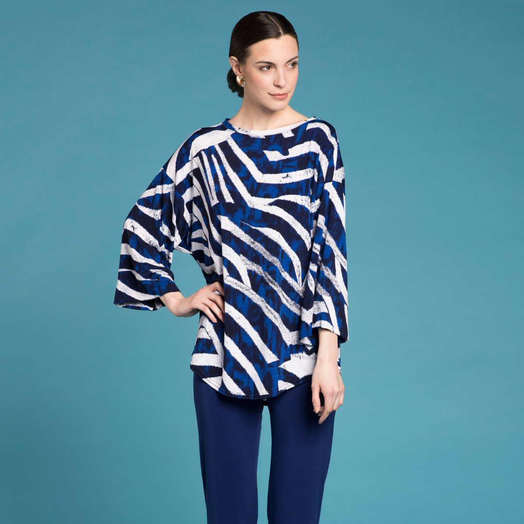 A stylish Studio Tunic made from soft drapey jersey fabric, featuring a scoop-neck design and a flattering silhouette.