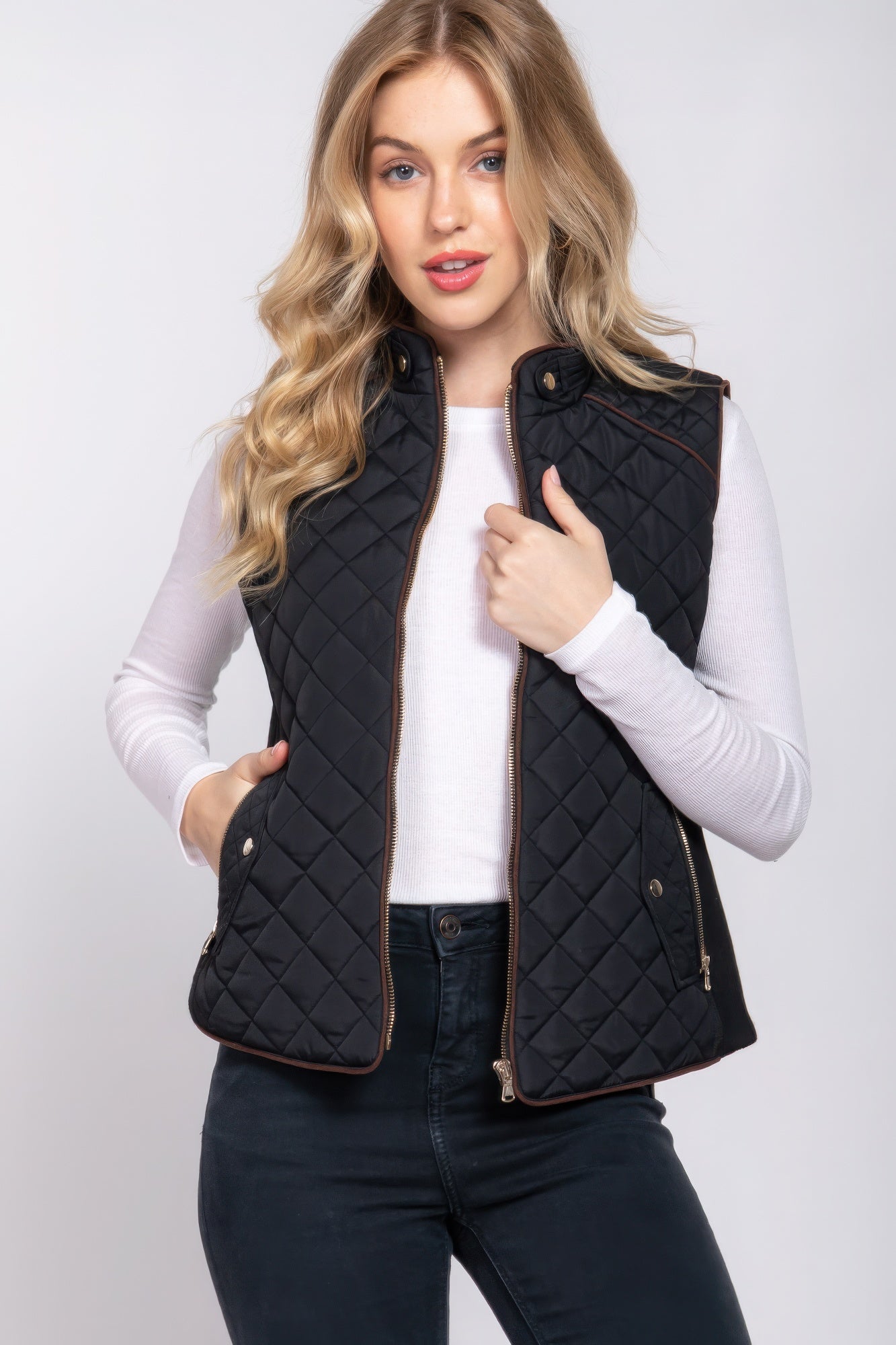 A stylish Suede Piping Quilted Padding Vest in Pale Taupe color, featuring suede piping details and front pockets, perfect for layering.