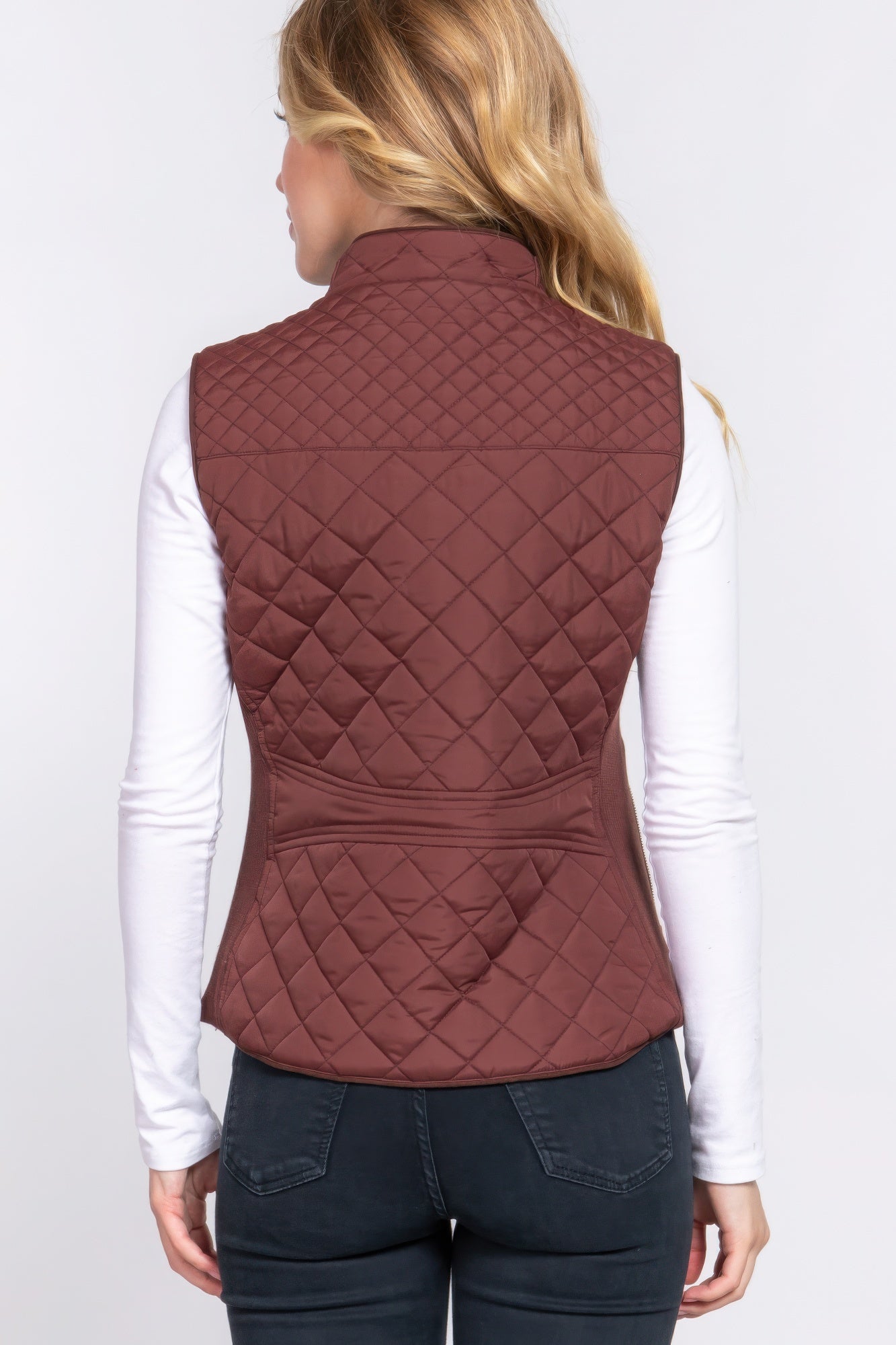 A stylish Suede Piping Quilted Padding Vest in Pale Taupe color, featuring suede piping details and front pockets, perfect for layering.