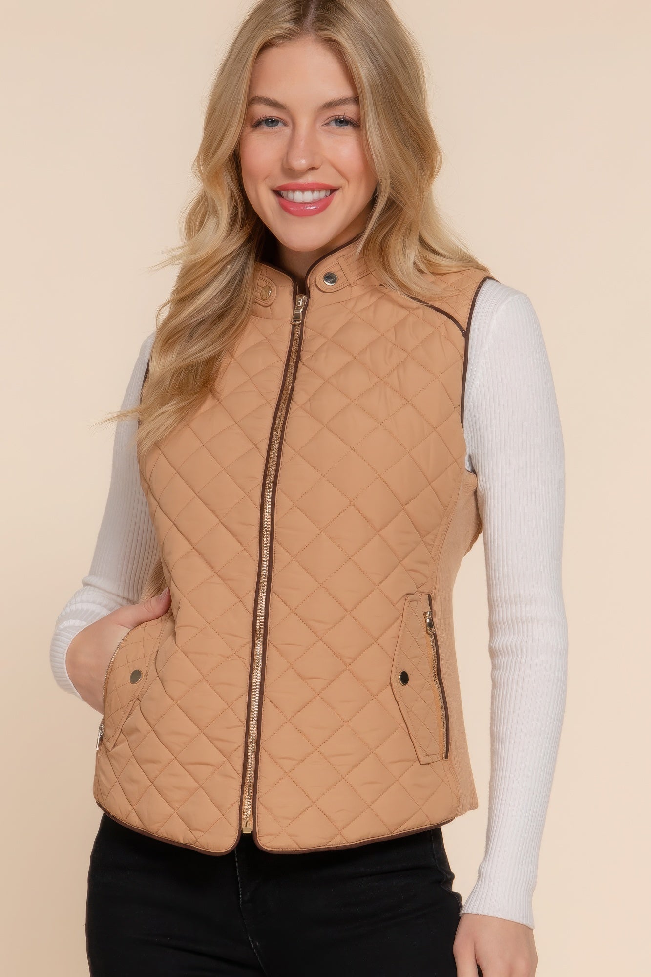 A stylish Suede Piping Quilted Padding Vest in Pale Taupe color, featuring suede piping details and front pockets, perfect for layering.