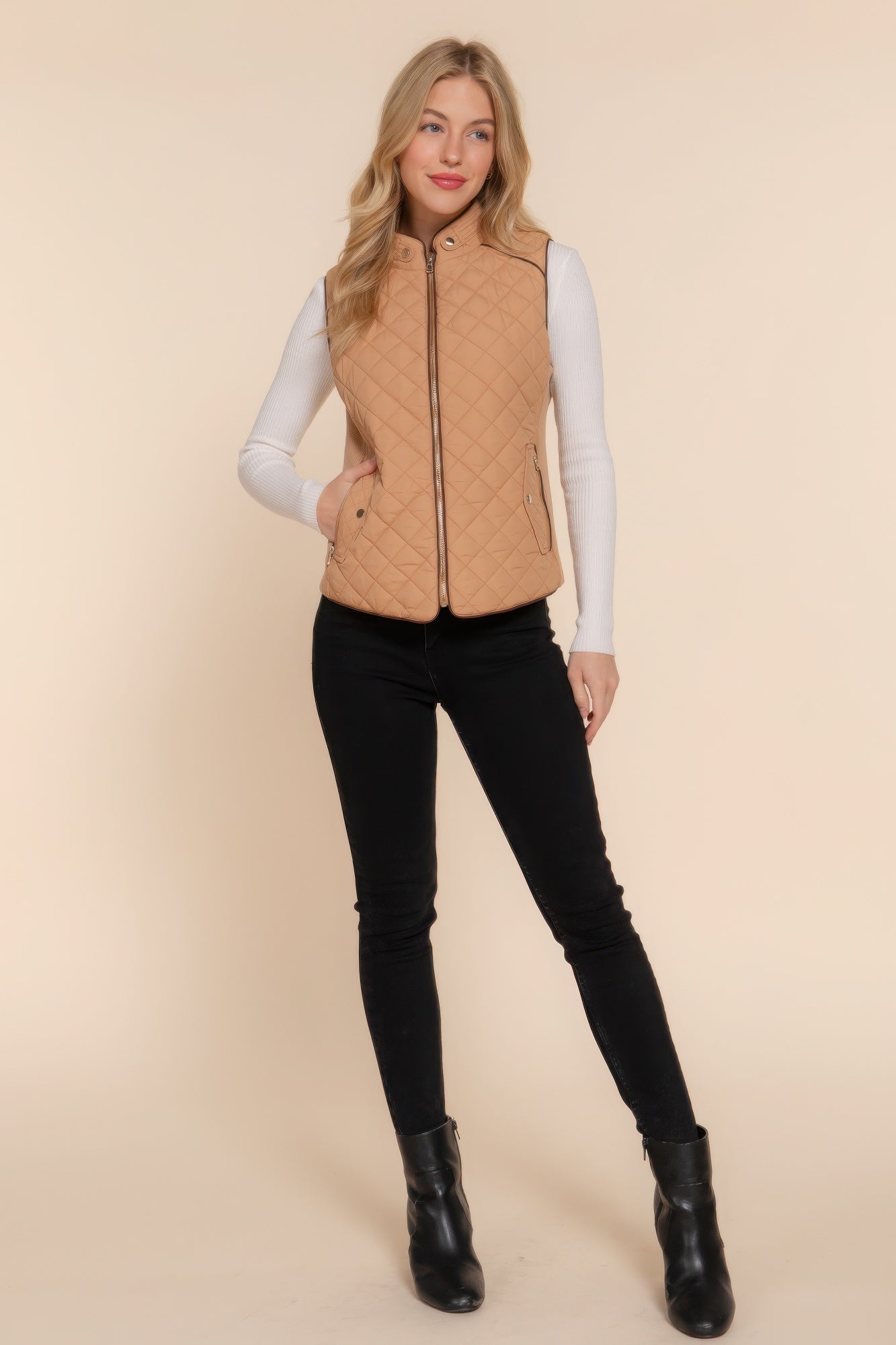 A stylish Suede Piping Quilted Padding Vest in Pale Taupe color, featuring suede piping details and front pockets, perfect for layering.