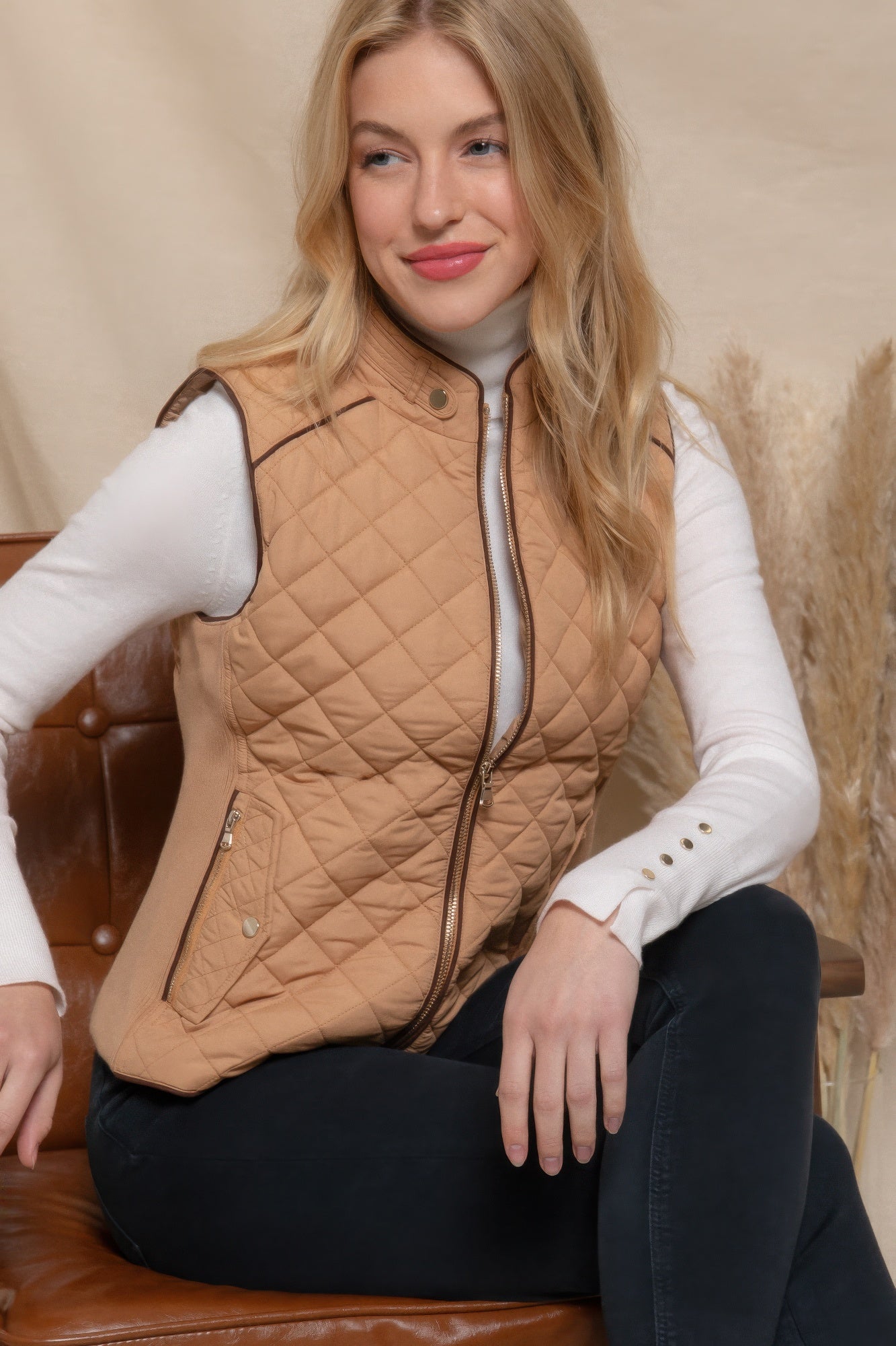 A stylish Suede Piping Quilted Padding Vest in Pale Taupe color, featuring suede piping details and front pockets, perfect for layering.