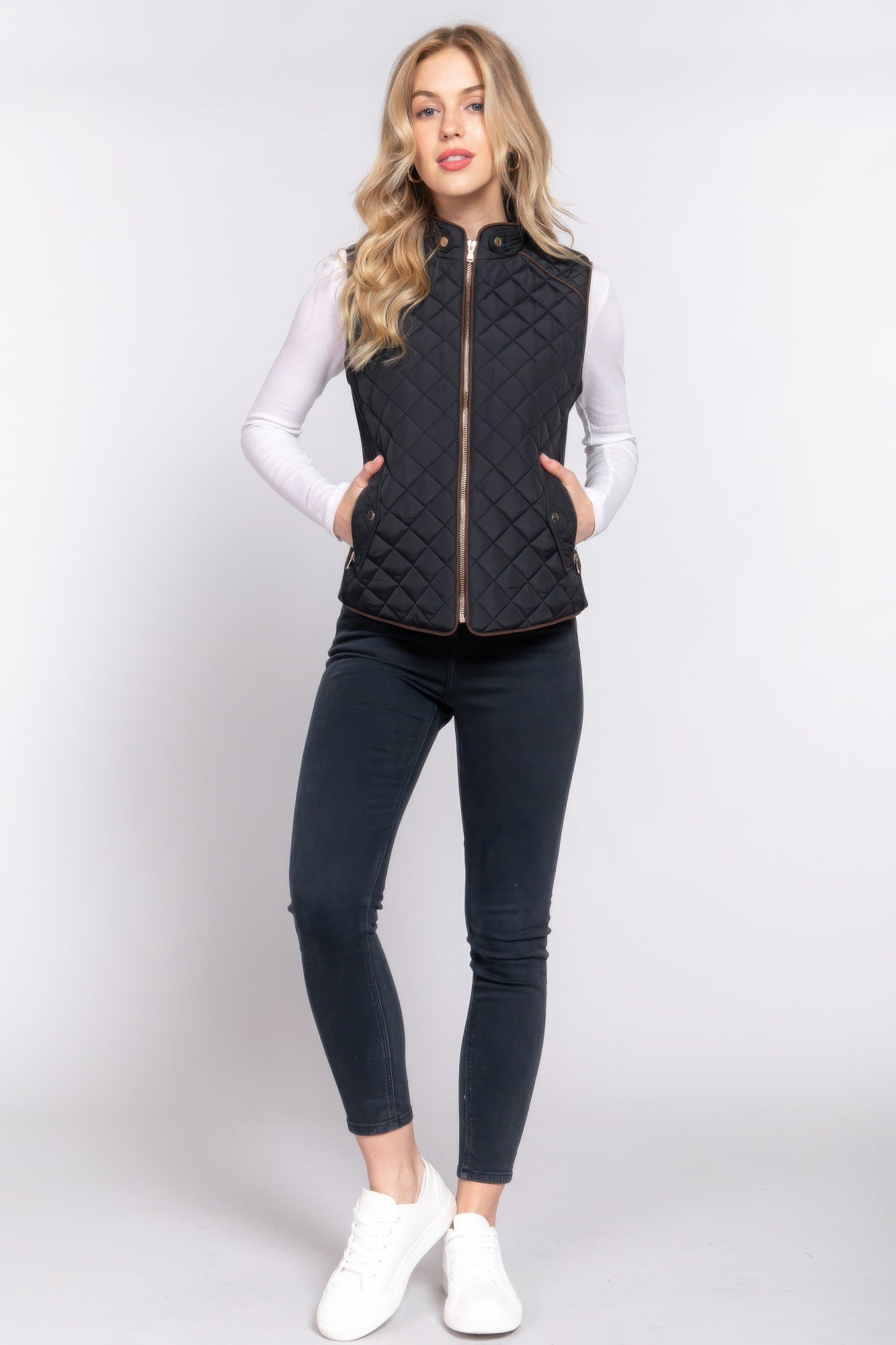 A stylish Suede Piping Quilted Padding Vest in Pale Taupe color, featuring suede piping details and front pockets, perfect for layering.