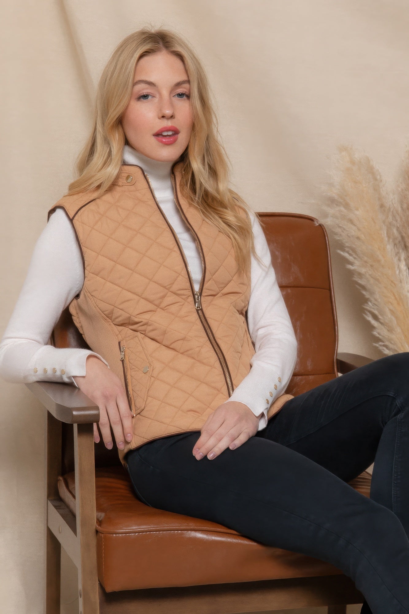 A stylish Suede Piping Quilted Padding Vest in Pale Taupe color, featuring suede piping details and front pockets, perfect for layering.