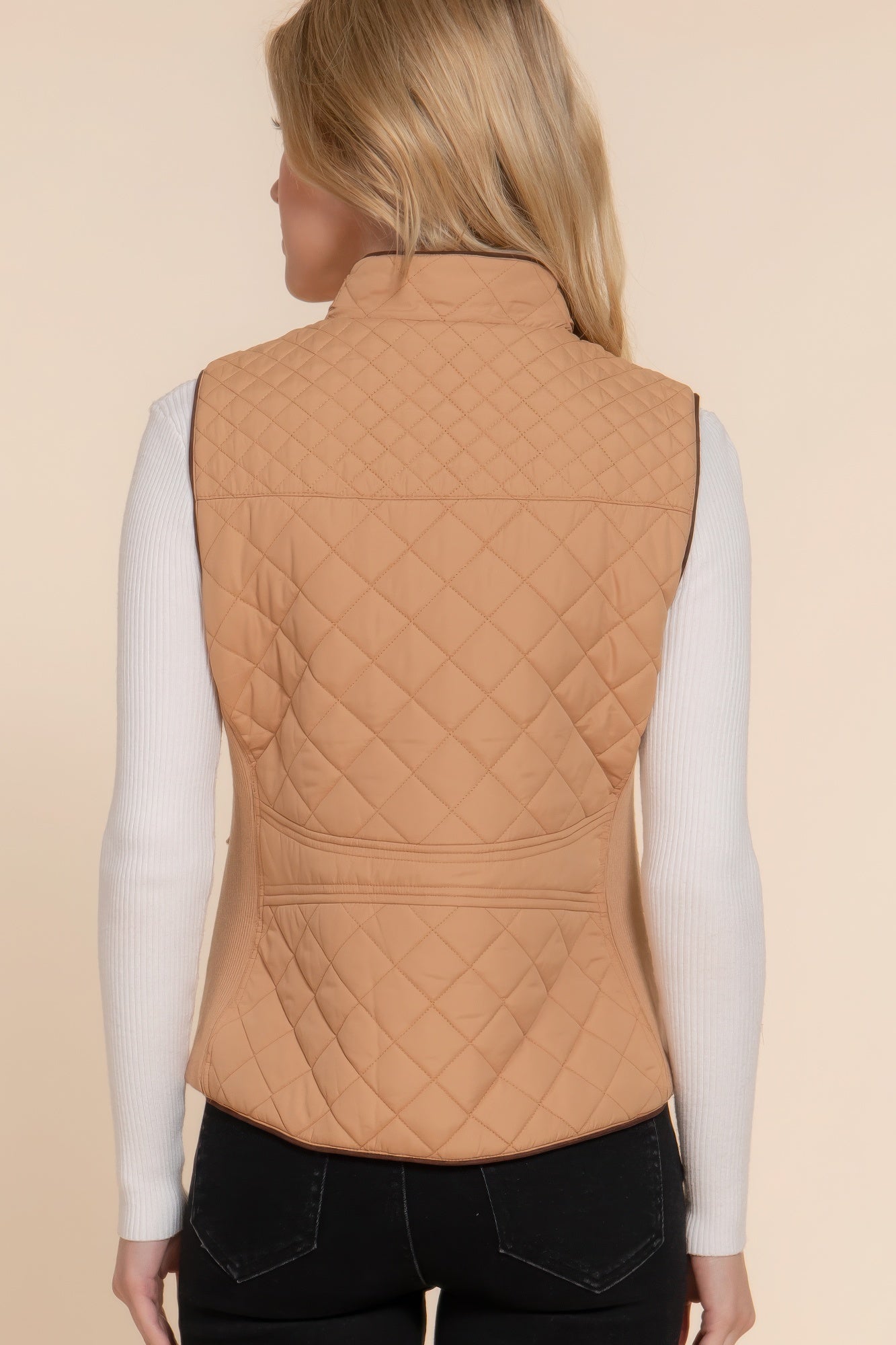 A stylish Suede Piping Quilted Padding Vest in Pale Taupe color, featuring suede piping details and front pockets, perfect for layering.