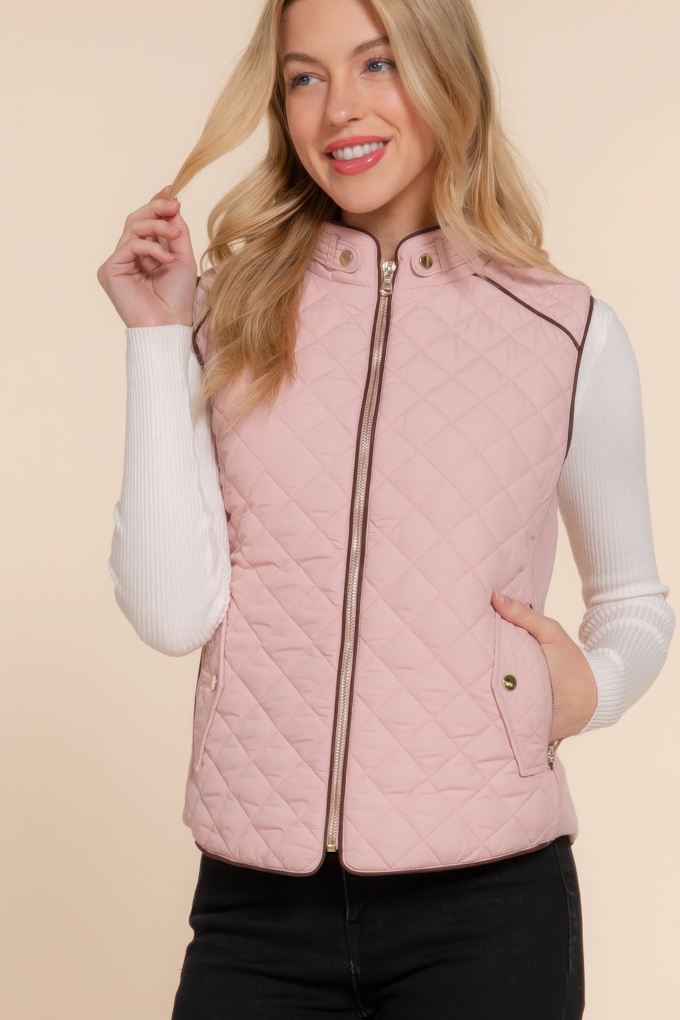 A stylish Suede Piping Quilted Padding Vest in Pale Taupe color, featuring suede piping details and front pockets, perfect for layering.