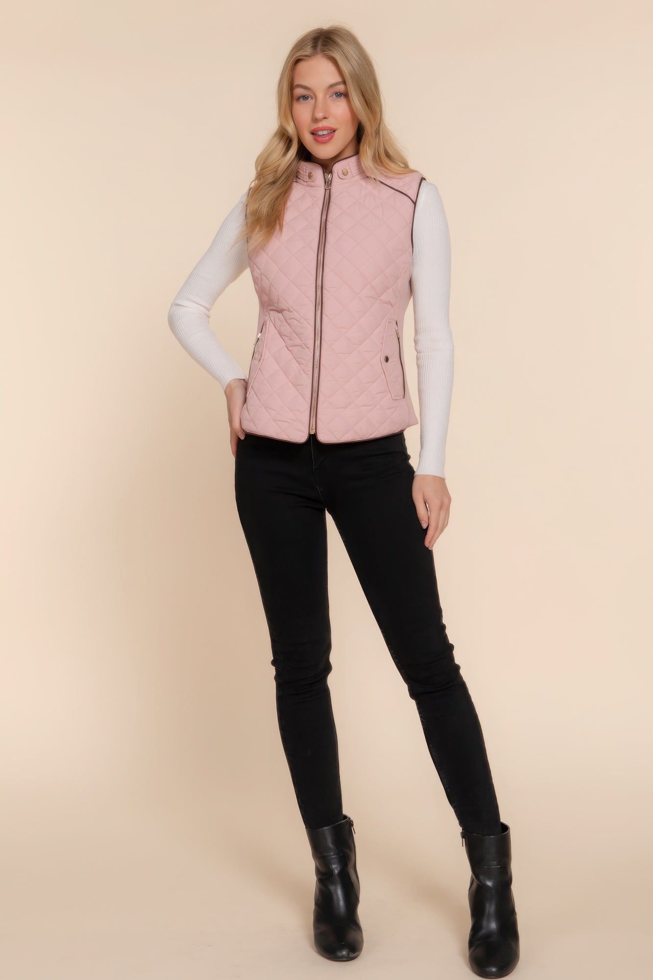 A stylish Suede Piping Quilted Padding Vest in Pale Taupe color, featuring suede piping details and front pockets, perfect for layering.