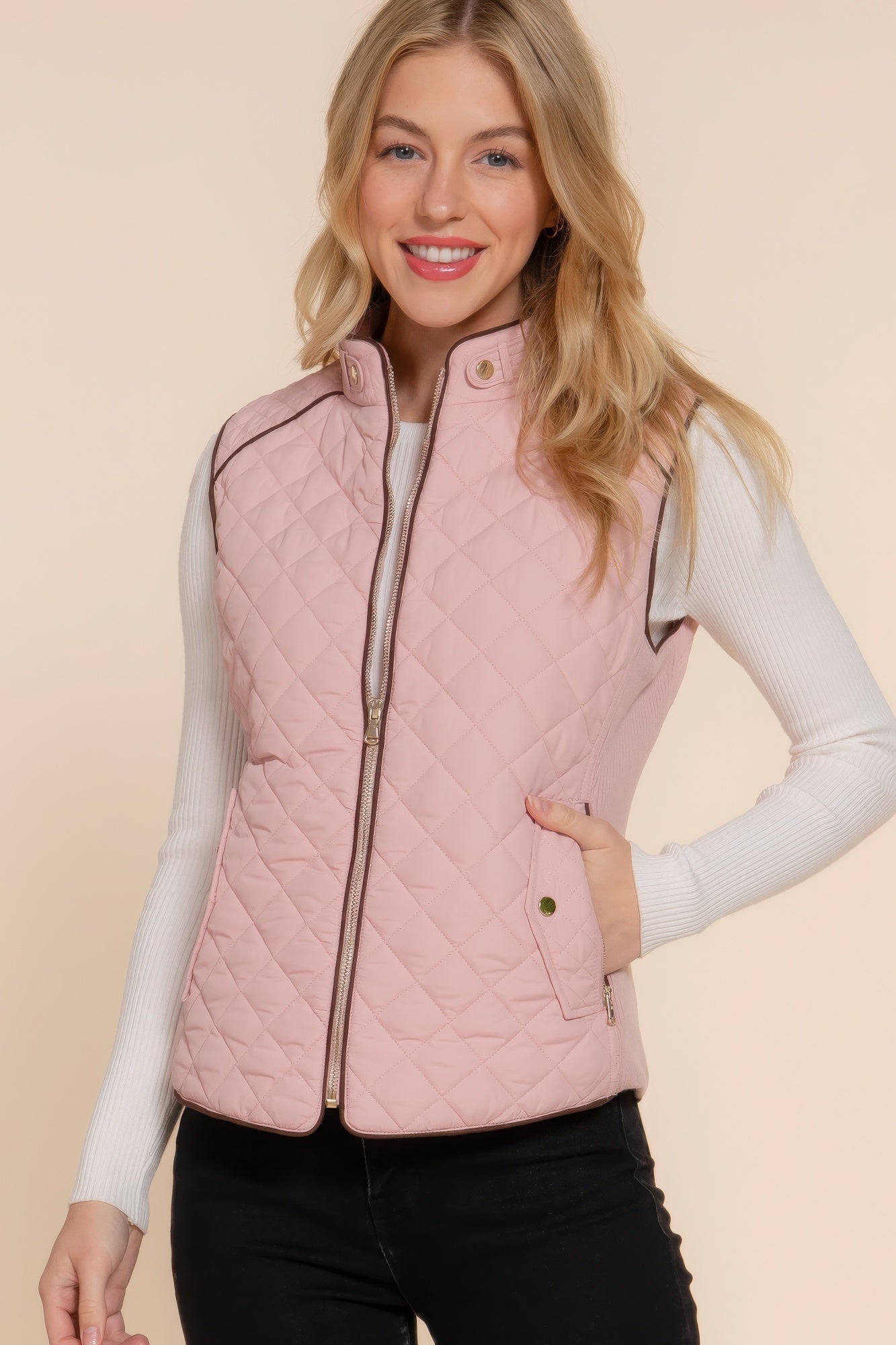 A stylish Suede Piping Quilted Padding Vest in Pale Taupe color, featuring suede piping details and front pockets, perfect for layering.