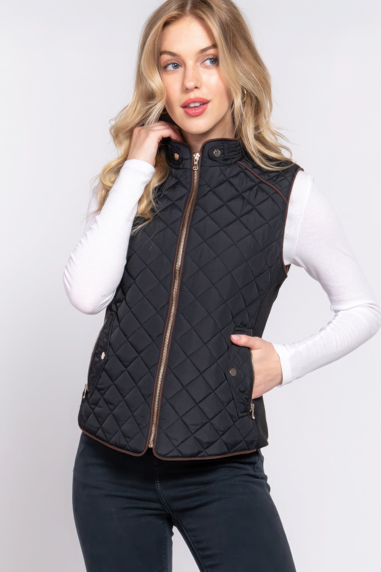 A stylish Suede Piping Quilted Padding Vest in Pale Taupe color, featuring suede piping details and front pockets, perfect for layering.