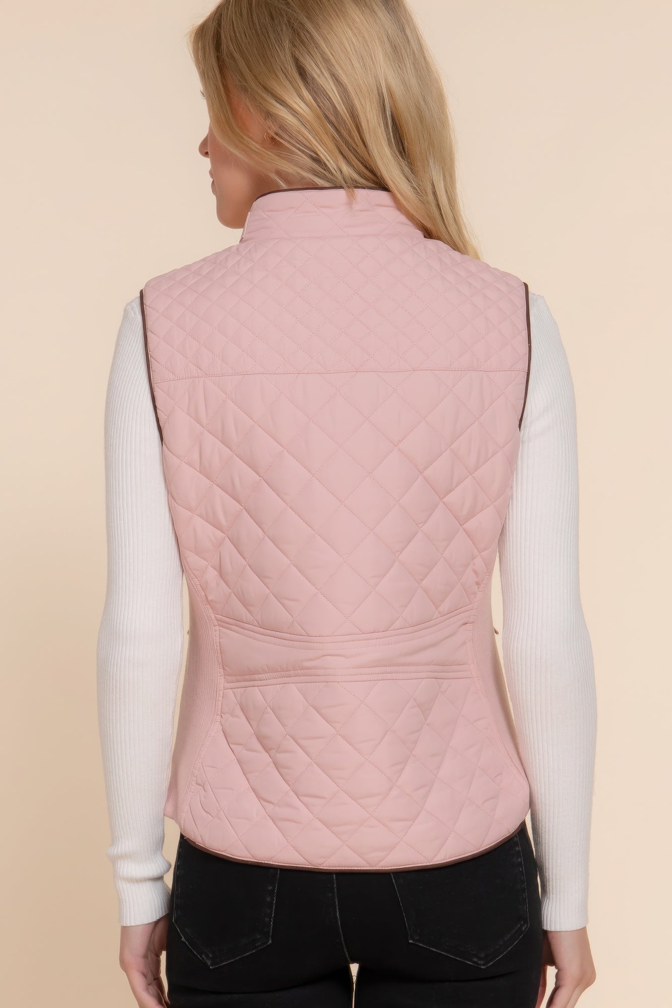 A stylish Suede Piping Quilted Padding Vest in Pale Taupe color, featuring suede piping details and front pockets, perfect for layering.