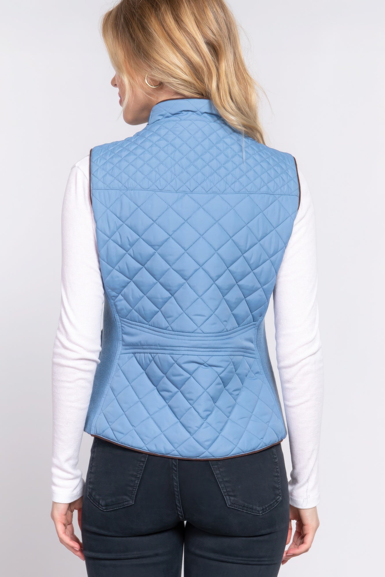 A stylish Suede Piping Quilted Padding Vest in Pale Taupe color, featuring suede piping details and front pockets, perfect for layering.