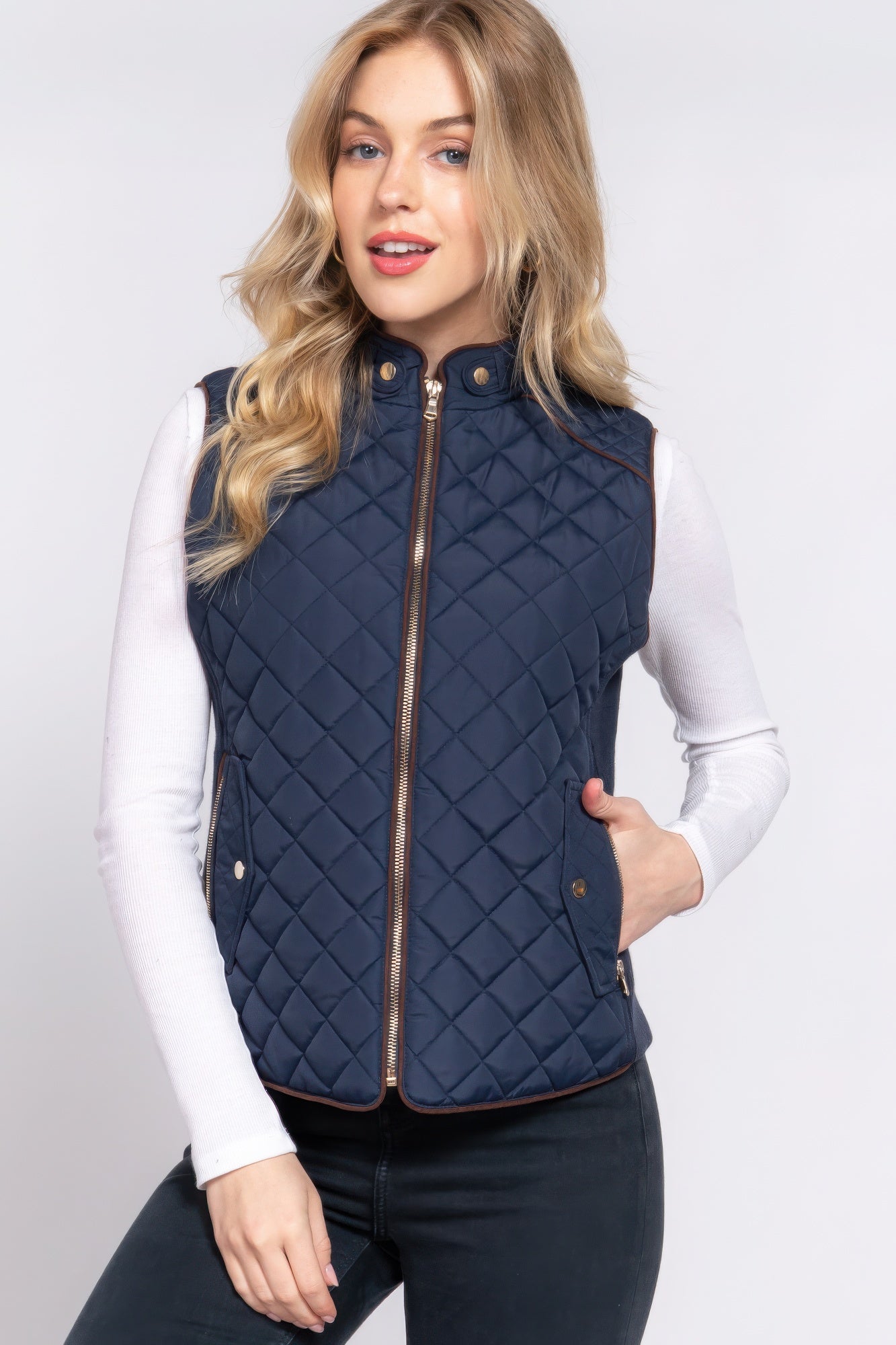 A stylish Suede Piping Quilted Padding Vest in Pale Taupe color, featuring suede piping details and front pockets, perfect for layering.