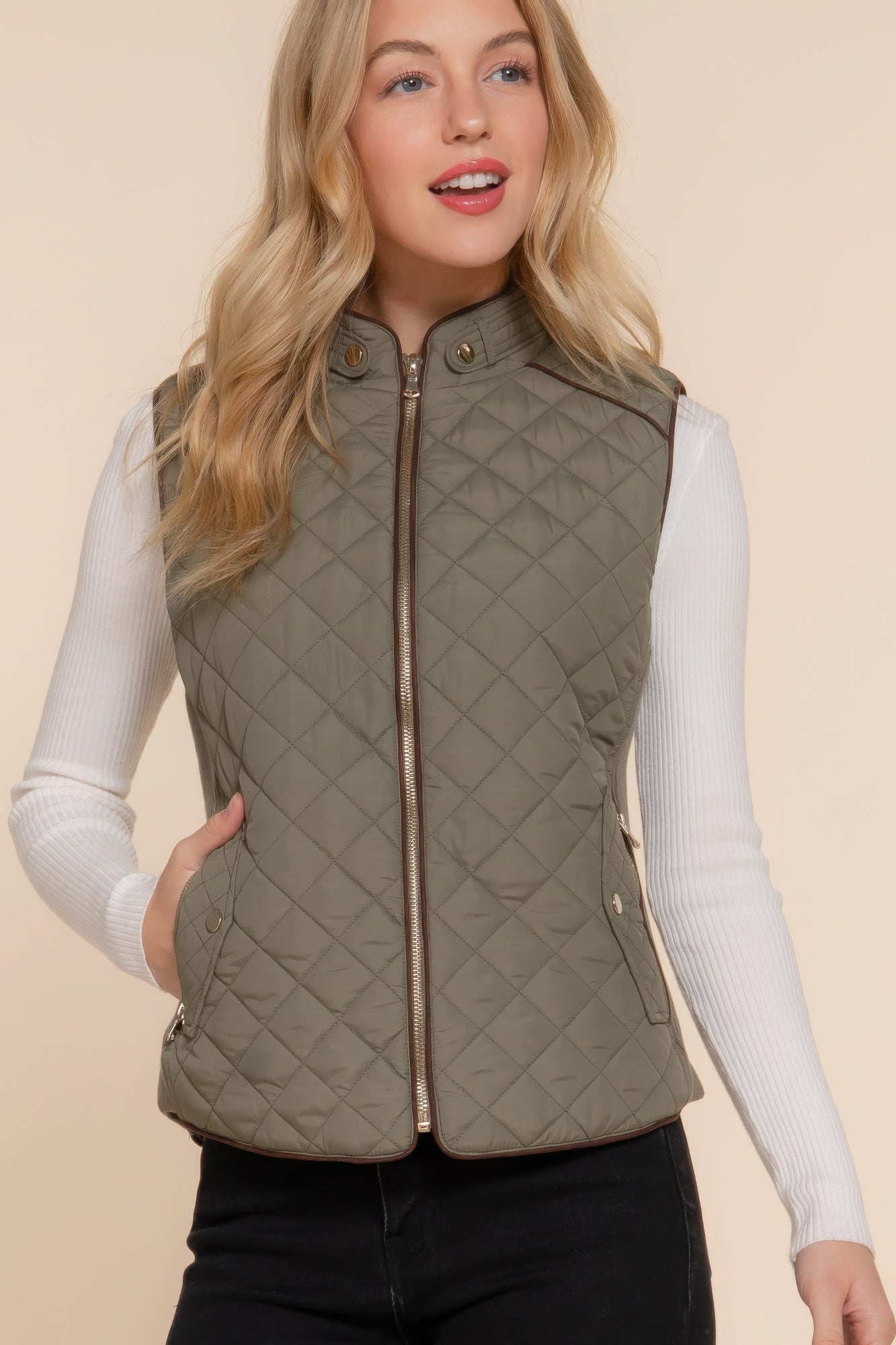 A stylish Suede Piping Quilted Padding Vest in Pale Taupe color, featuring suede piping details and front pockets, perfect for layering.