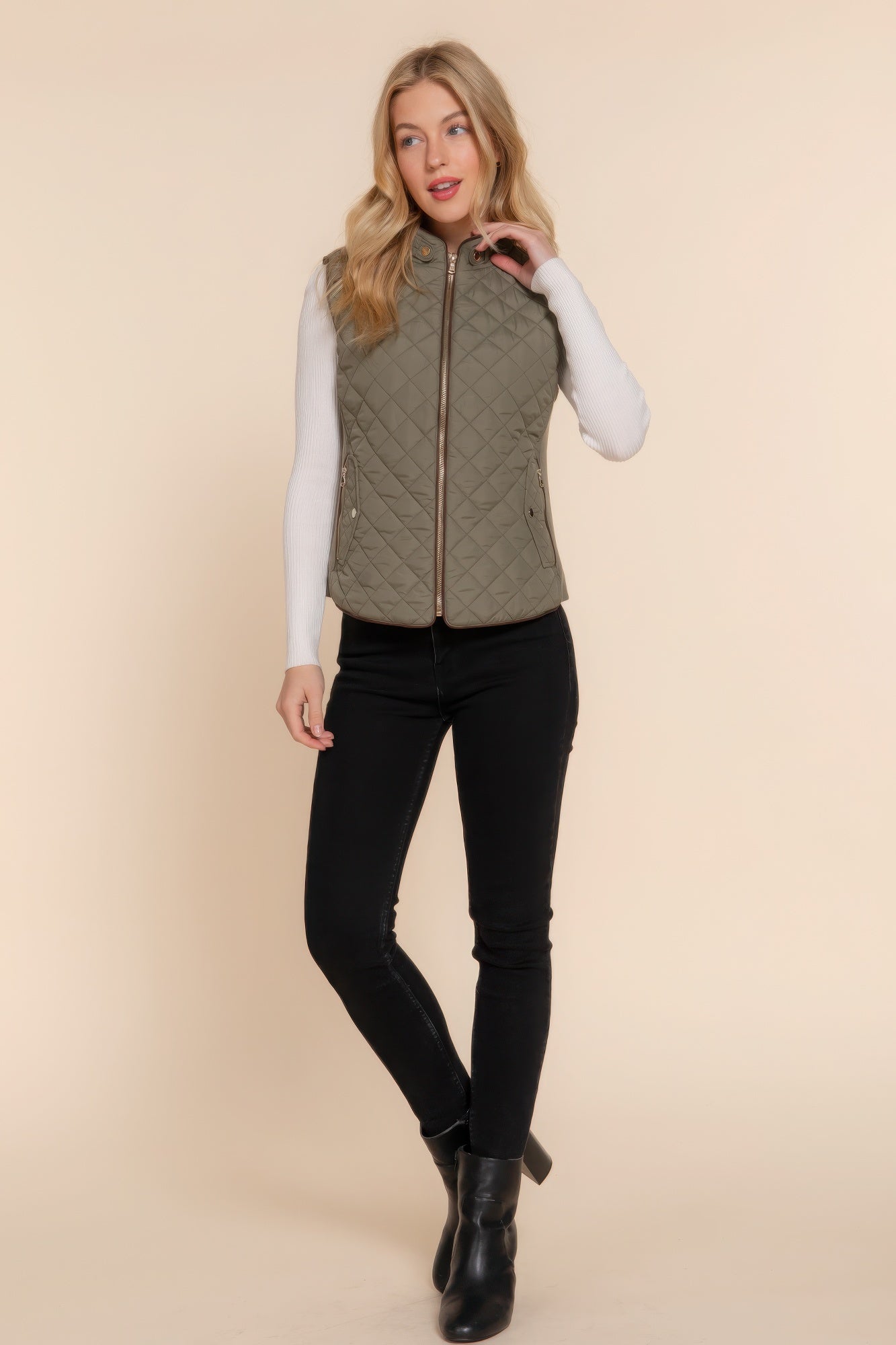 A stylish Suede Piping Quilted Padding Vest in Pale Taupe color, featuring suede piping details and front pockets, perfect for layering.