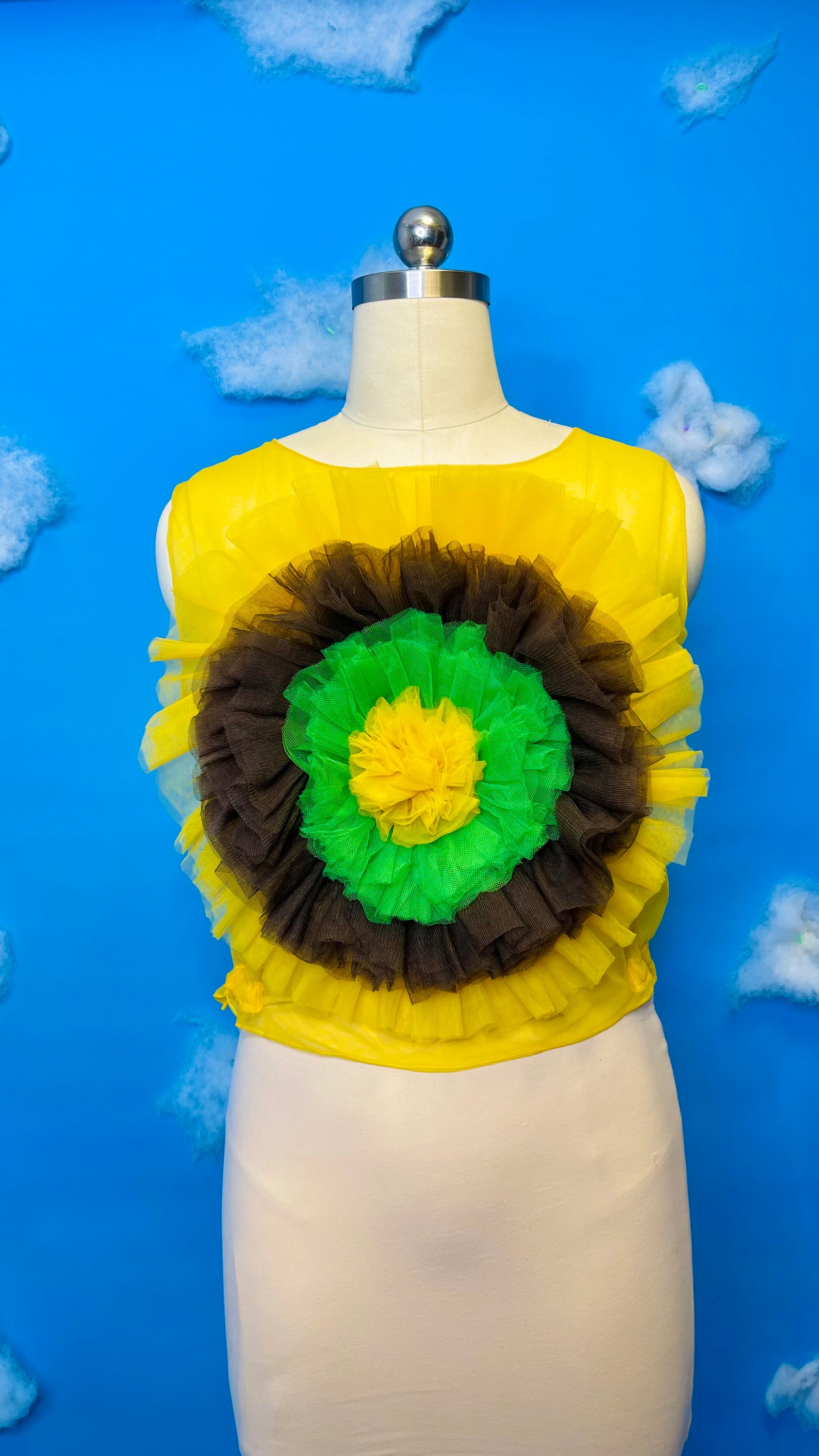 A vibrant sunflower blossom top featuring a cheerful floral design, perfect for adding a pop of color to any outfit.