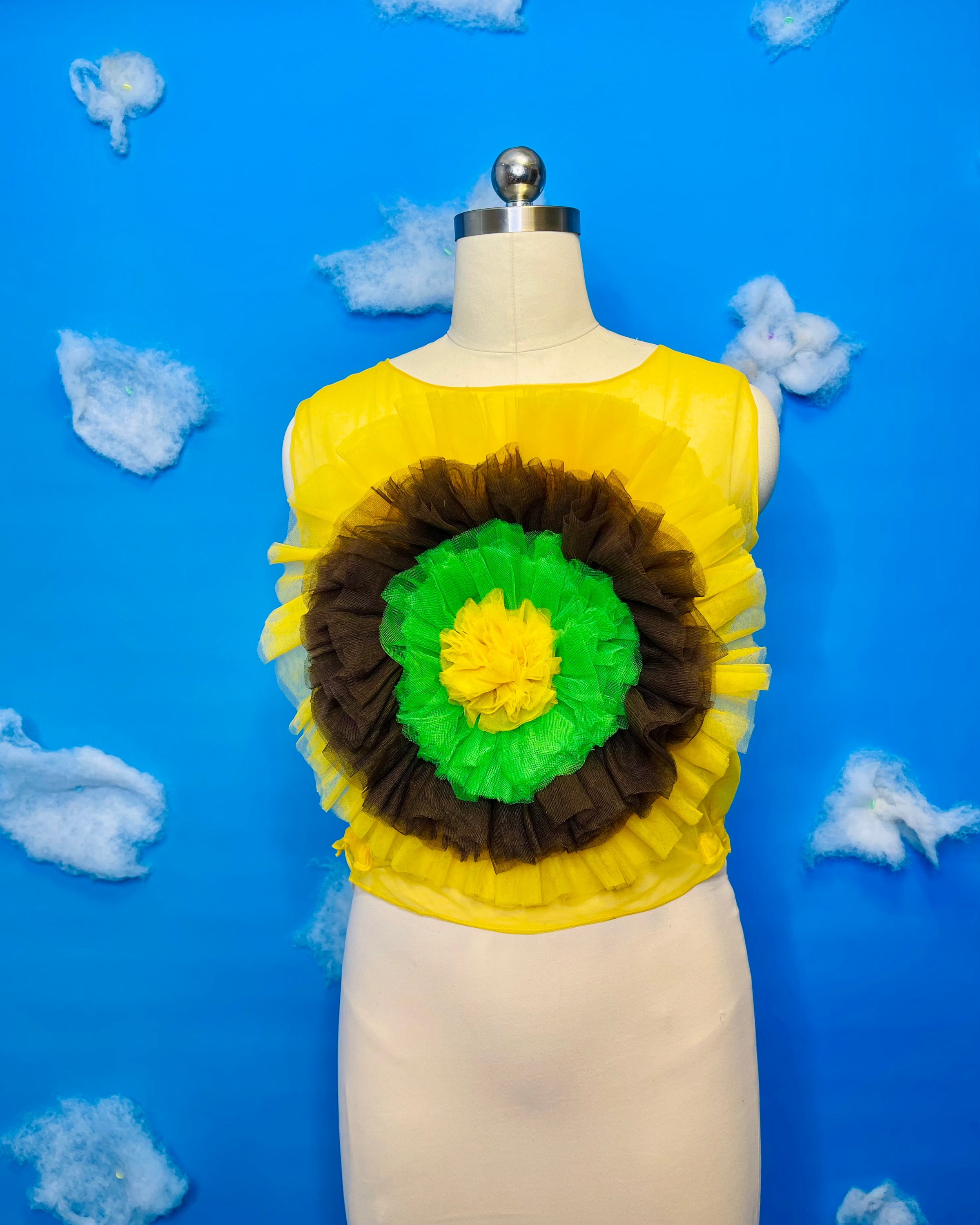 A vibrant sunflower blossom top featuring a cheerful floral design, perfect for adding a pop of color to any outfit.