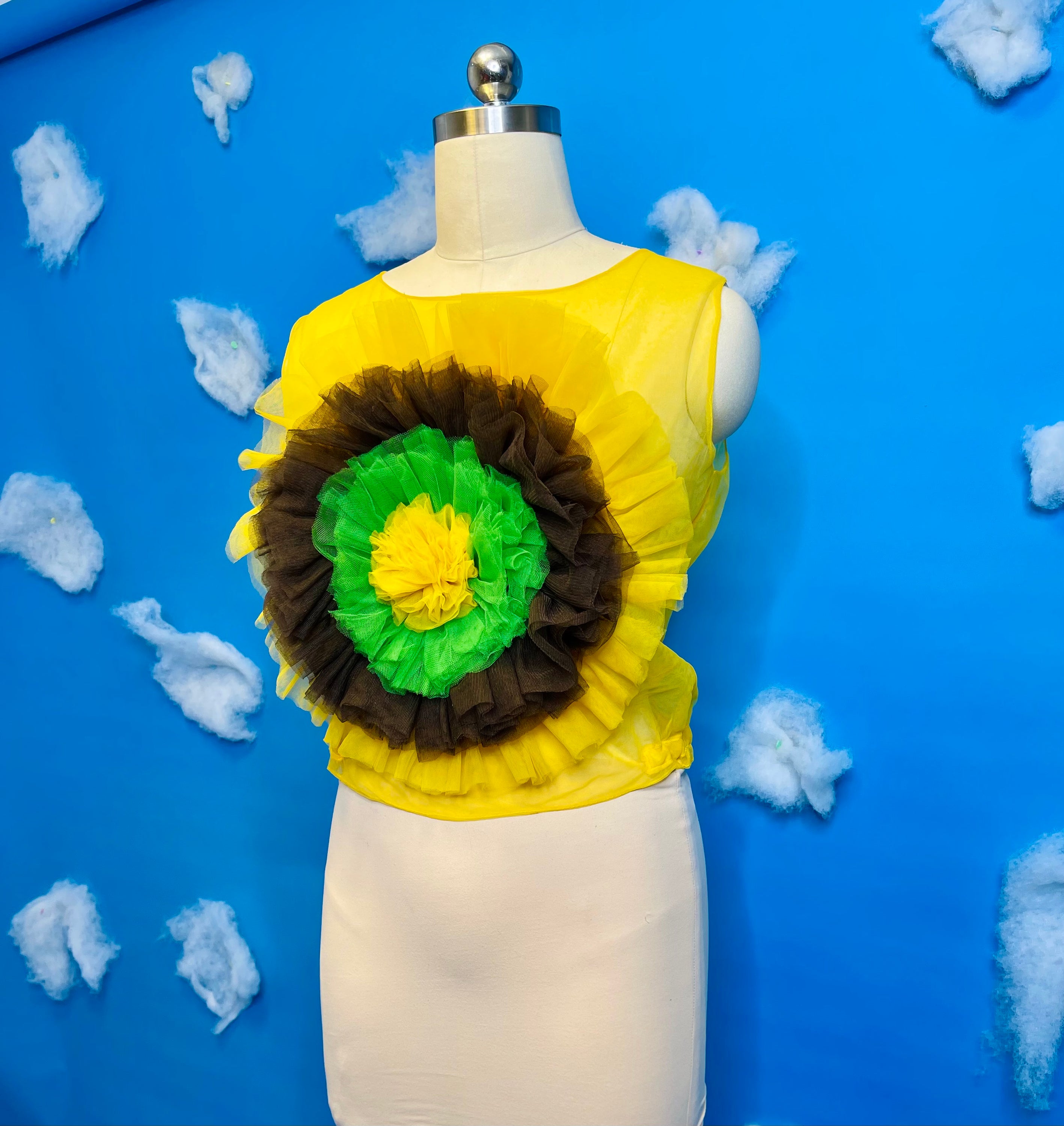 A vibrant sunflower blossom top featuring a cheerful floral design, perfect for adding a pop of color to any outfit.