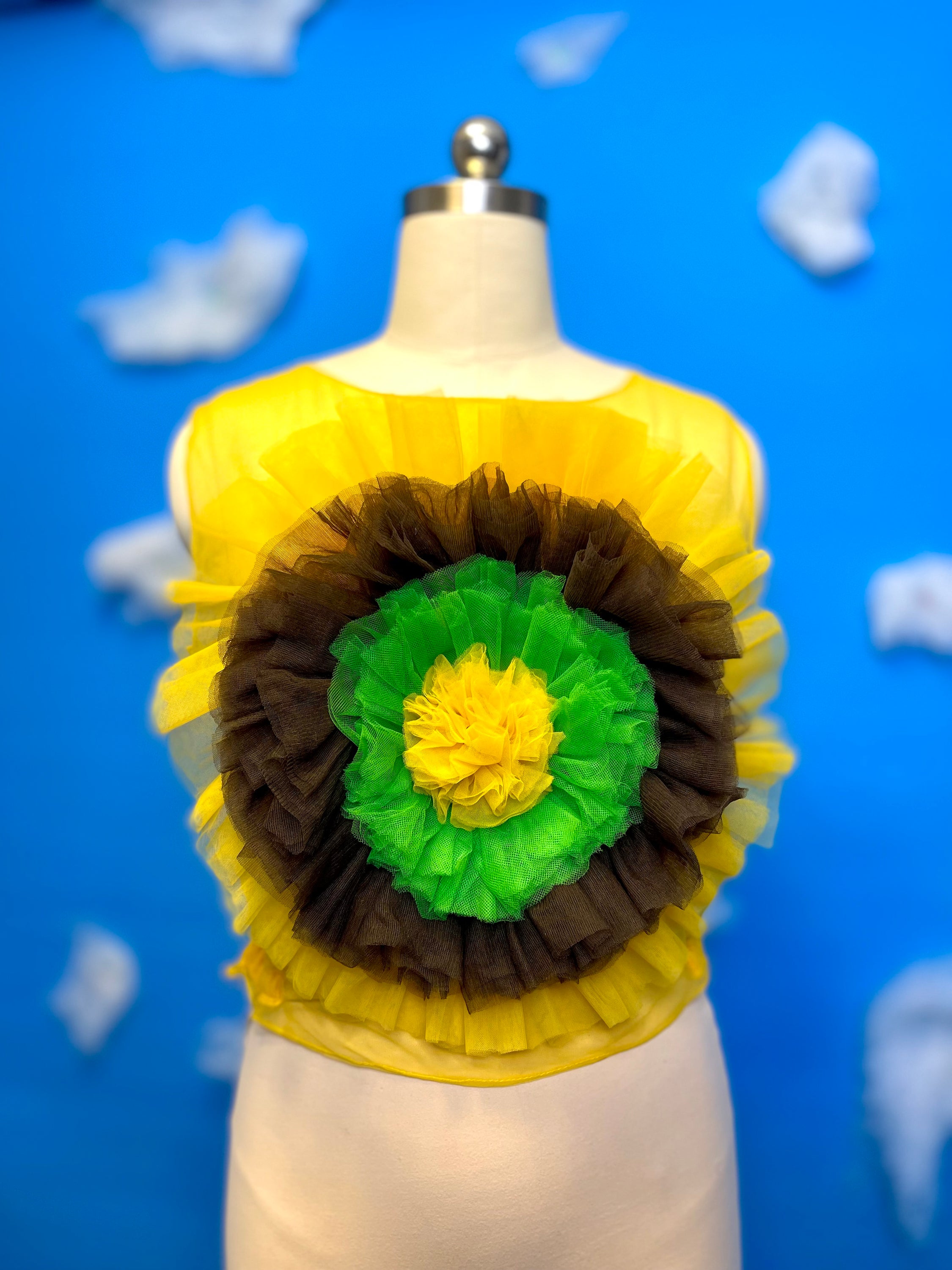 A vibrant sunflower blossom top featuring a cheerful floral design, perfect for adding a pop of color to any outfit.