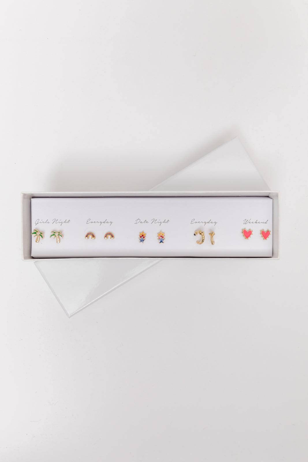 Five pairs of gold earrings in a stylish box, designed for various occasions.