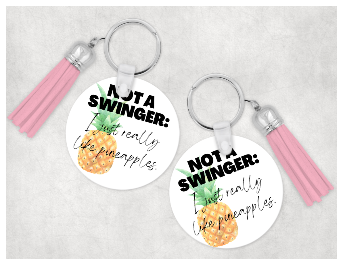 A colorful Sweary Keychain with a humorous design and a randomly selected tassel, perfect for key organization.