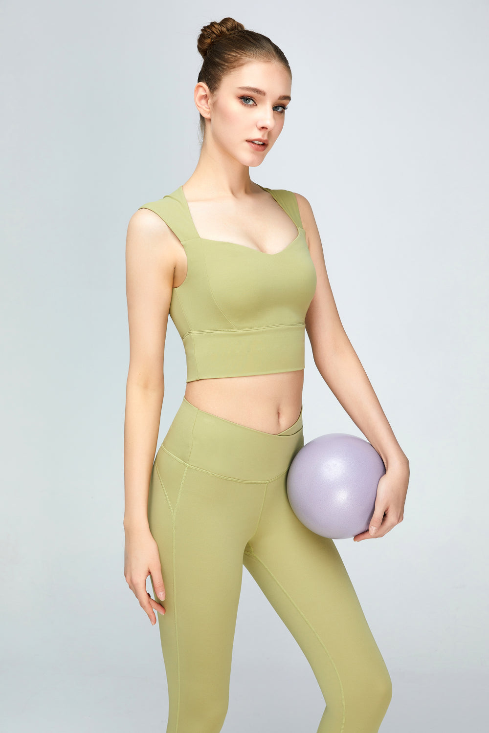 A stylish sweat absorbing sleeveless sports bra in solid color, featuring a Queen Anne neckline and unremovable padding, perfect for yoga and active wear.