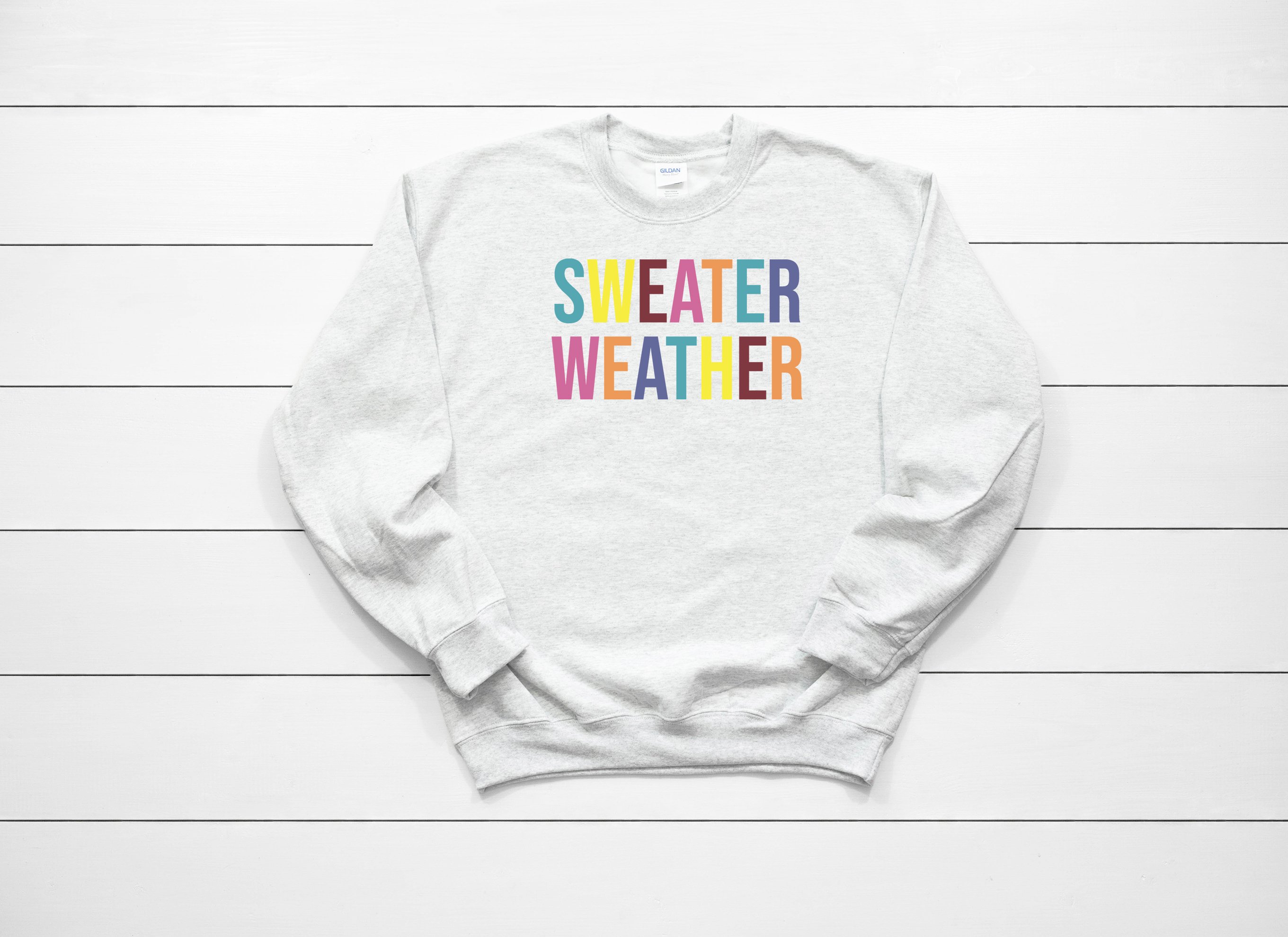 A cozy Sweater Weather Sweatshirt featuring a stylish design, perfect for chilly days, displayed on a neutral background.