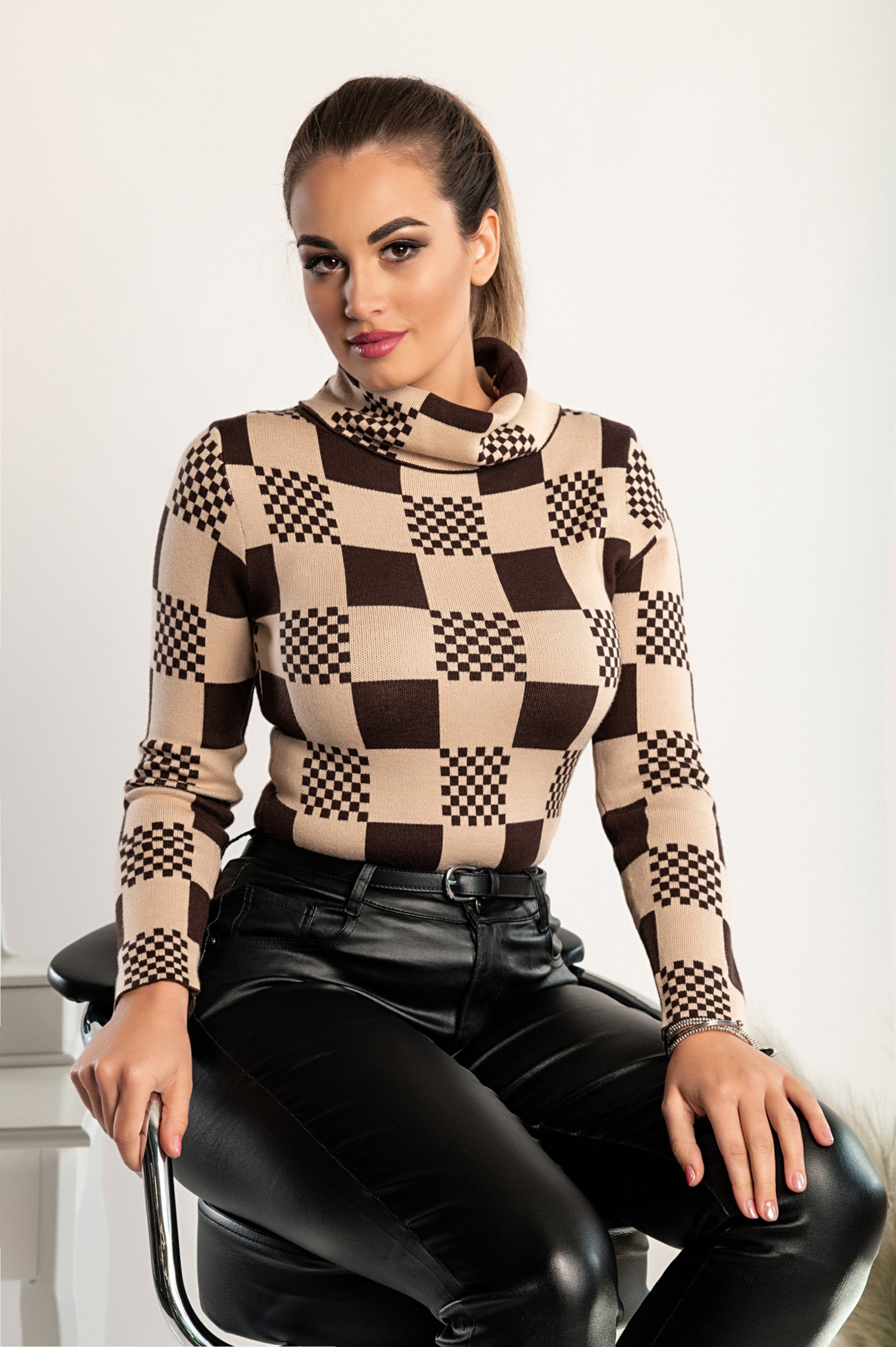 Brown sweater with check print featuring long sleeves and a folded neck, showcasing a stylish and comfortable design.