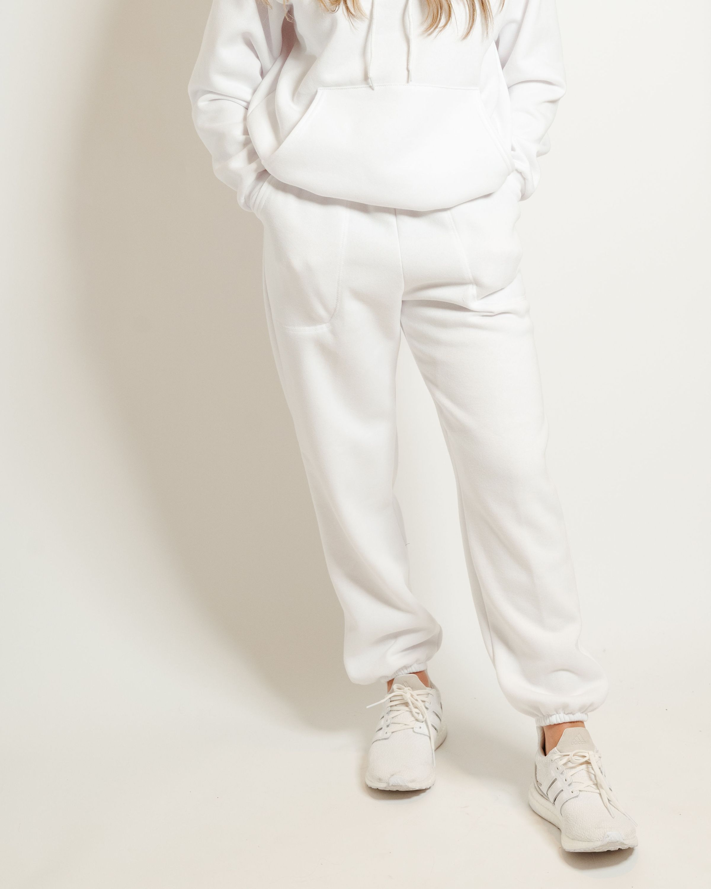 A pair of white sweatpants featuring a soft interior, perfect for lounging or casual outings.