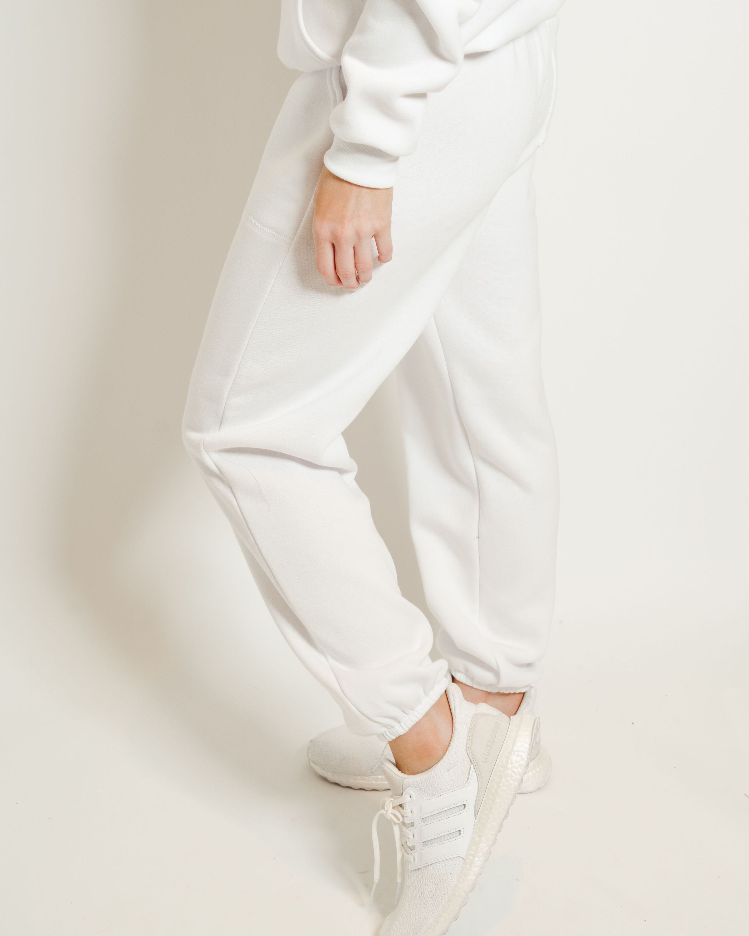 A pair of white sweatpants featuring a soft interior, perfect for lounging or casual outings.