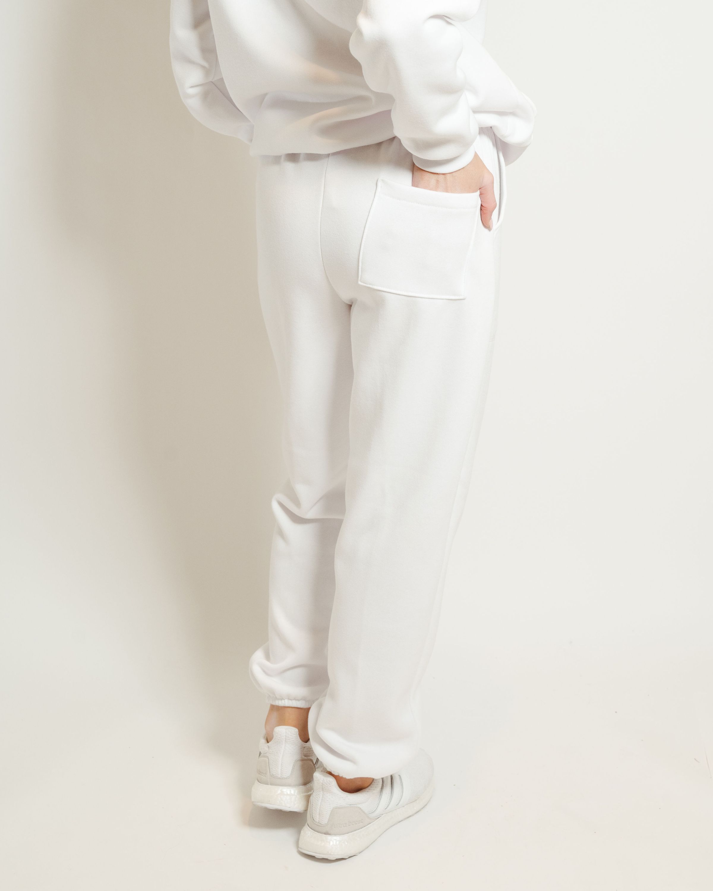 A pair of white sweatpants featuring a soft interior, perfect for lounging or casual outings.