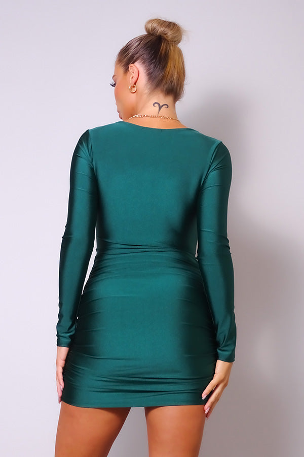 A stylish hunter green mini dress featuring a sweetheart neckline, long sleeves, and front pleat detail, perfect for a sexy and elegant look.