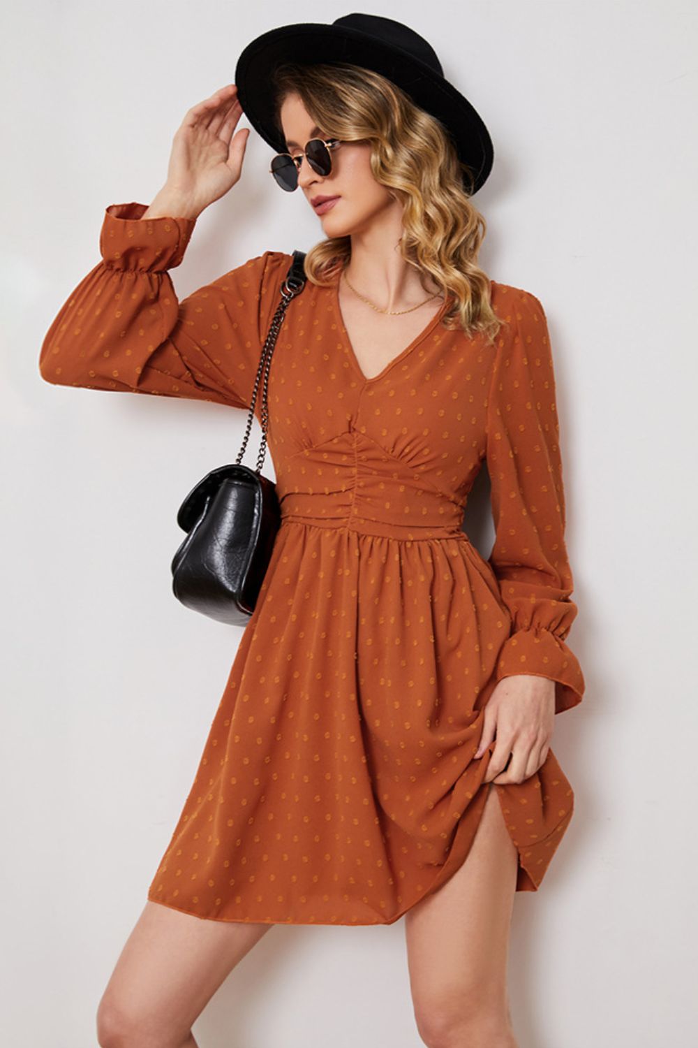 A stylish Swiss Dot Ruched V-Neck Flounce Sleeve Dress featuring long flounce sleeves and a chic A-line silhouette, perfect for elegant occasions.