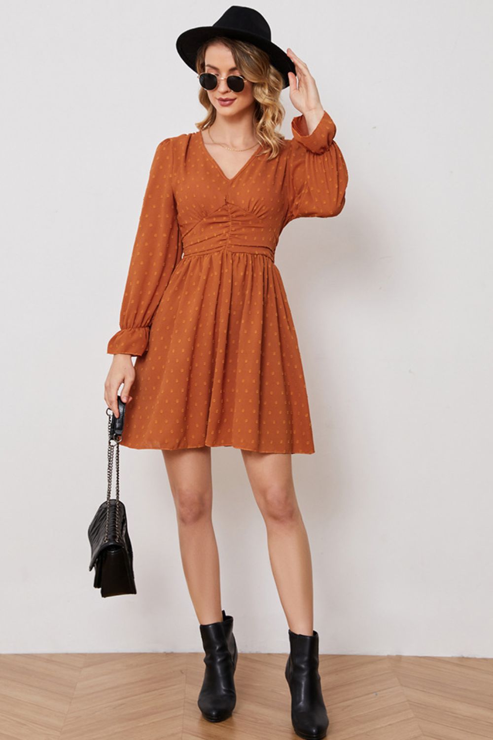 A stylish Swiss Dot Ruched V-Neck Flounce Sleeve Dress featuring long flounce sleeves and a chic A-line silhouette, perfect for elegant occasions.