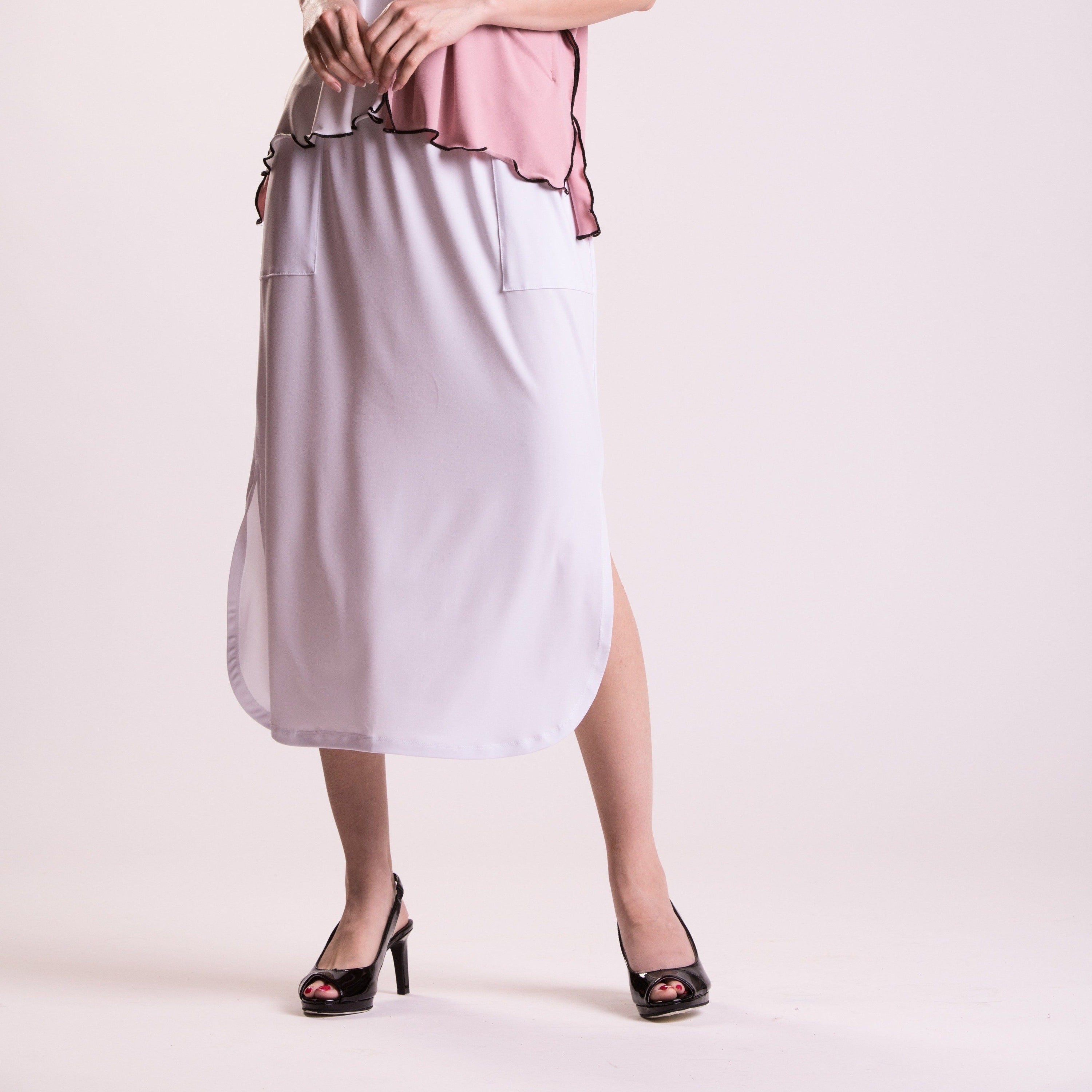 Sydney Pocket Skirt featuring a curved hem, pockets, and a wide elastic waistband, perfect for stylish comfort.