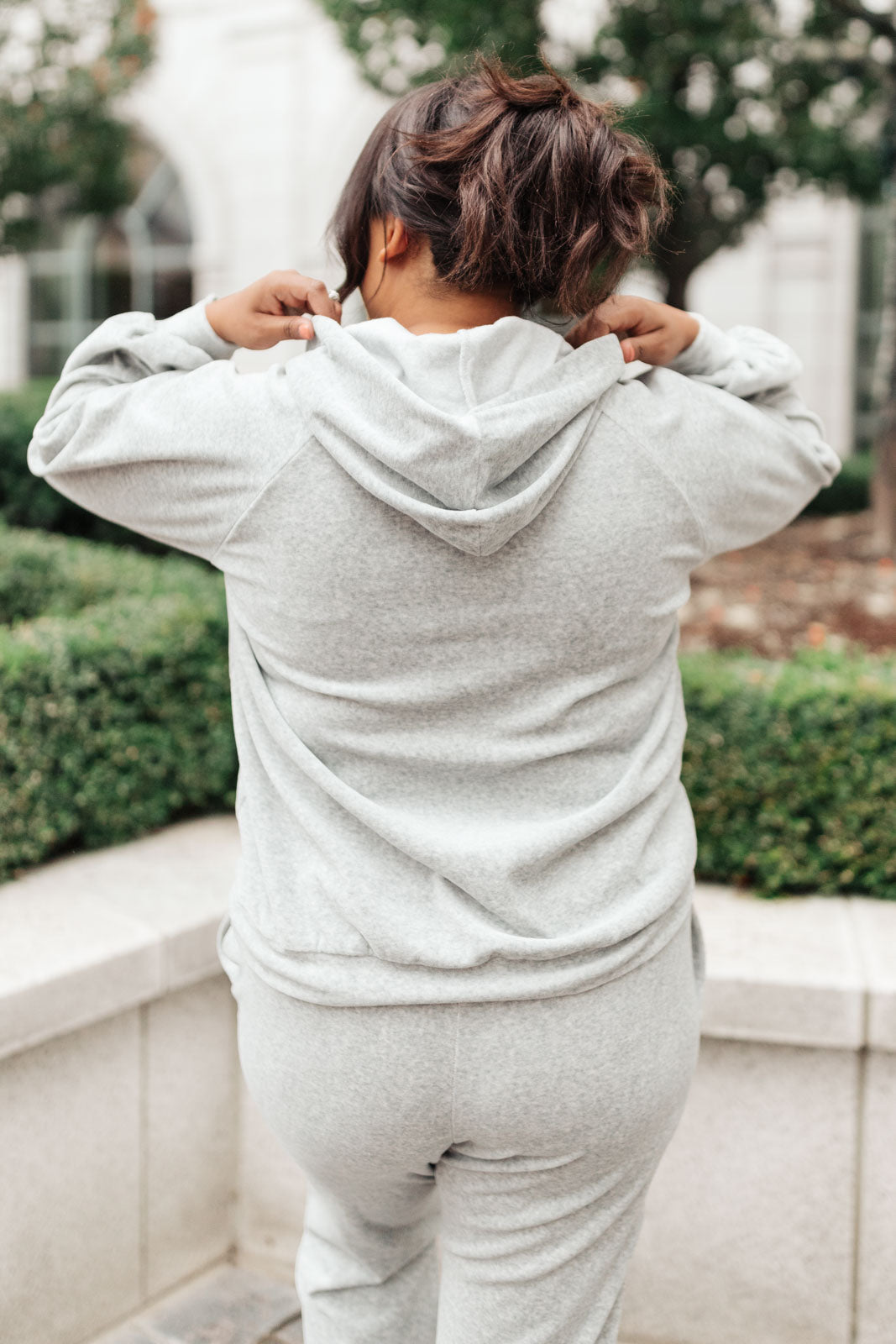 Cozy gray Take A Snow Day Lounge Top displayed on a hanger, showcasing its soft fabric and relaxed fit.