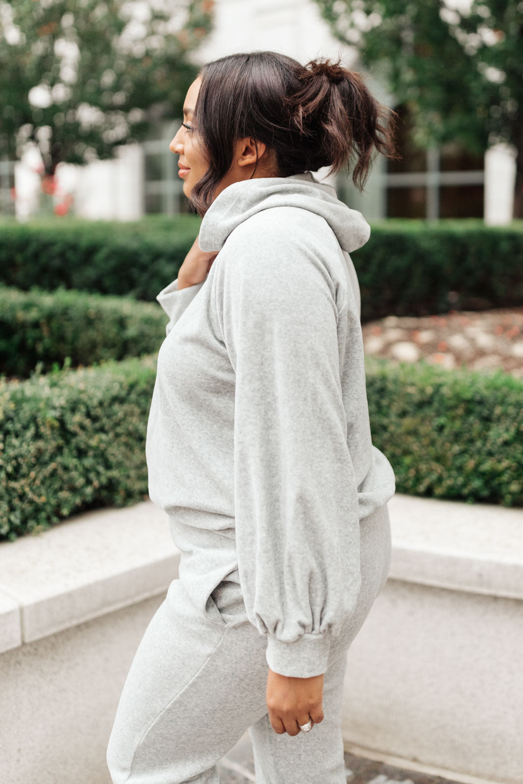 Cozy gray Take A Snow Day Lounge Top displayed on a hanger, showcasing its soft fabric and relaxed fit.