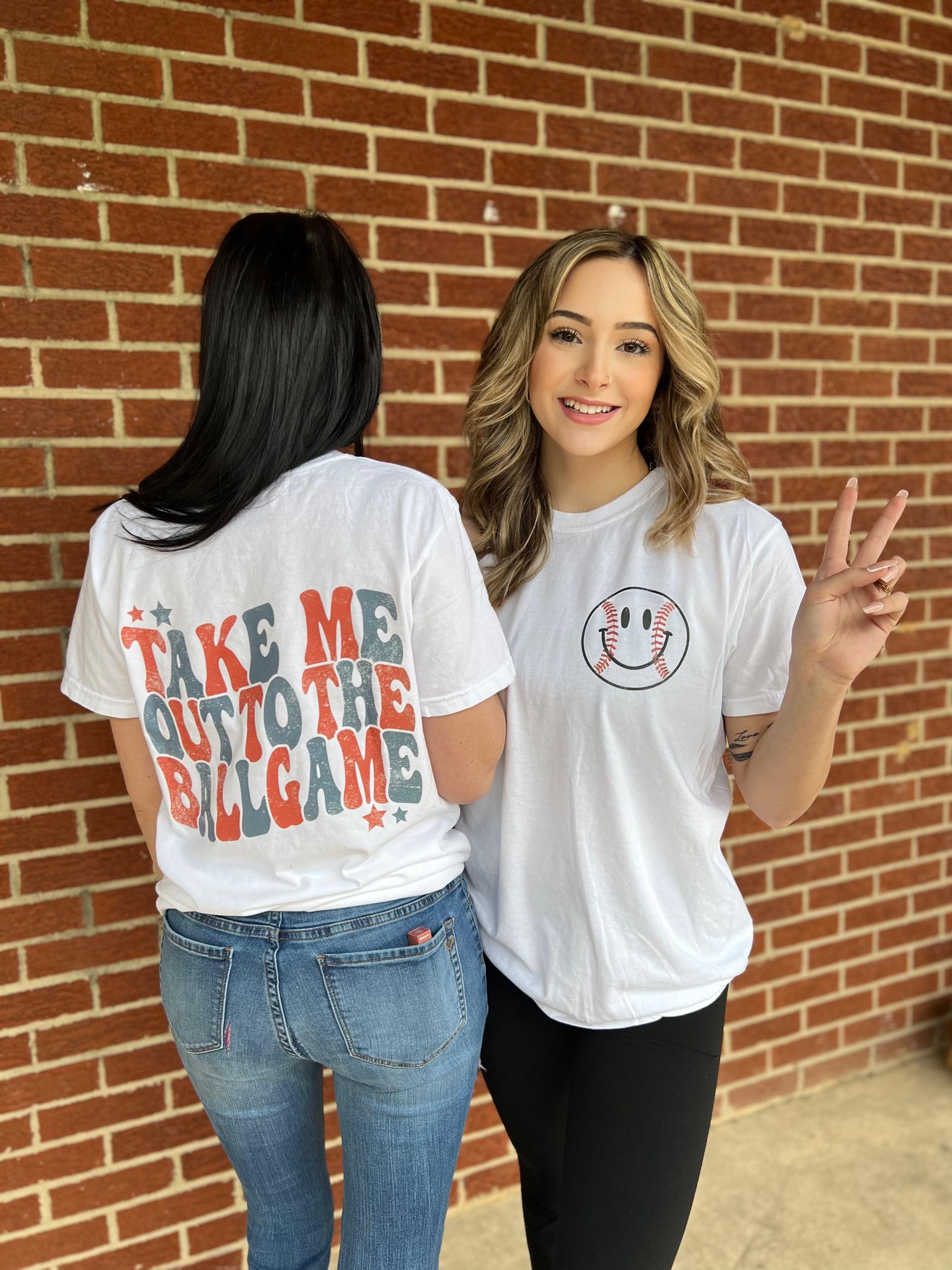 A comfortable white unisex tee with 'Take Me Out To The Ballgame' printed on it, perfect for baseball fans.