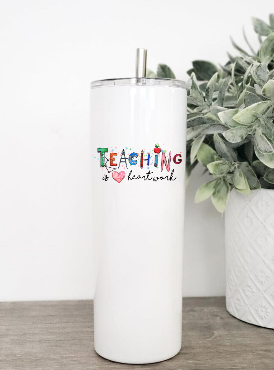 Teaching Is Heart Work Tumbler in stainless steel with clear slider lid and straw, available in 20 or 30 oz sizes.