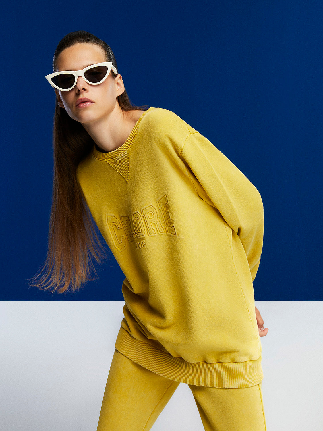 A cozy crew-neck oversized sweatshirt featuring a stylish front text print, perfect for casual wear.