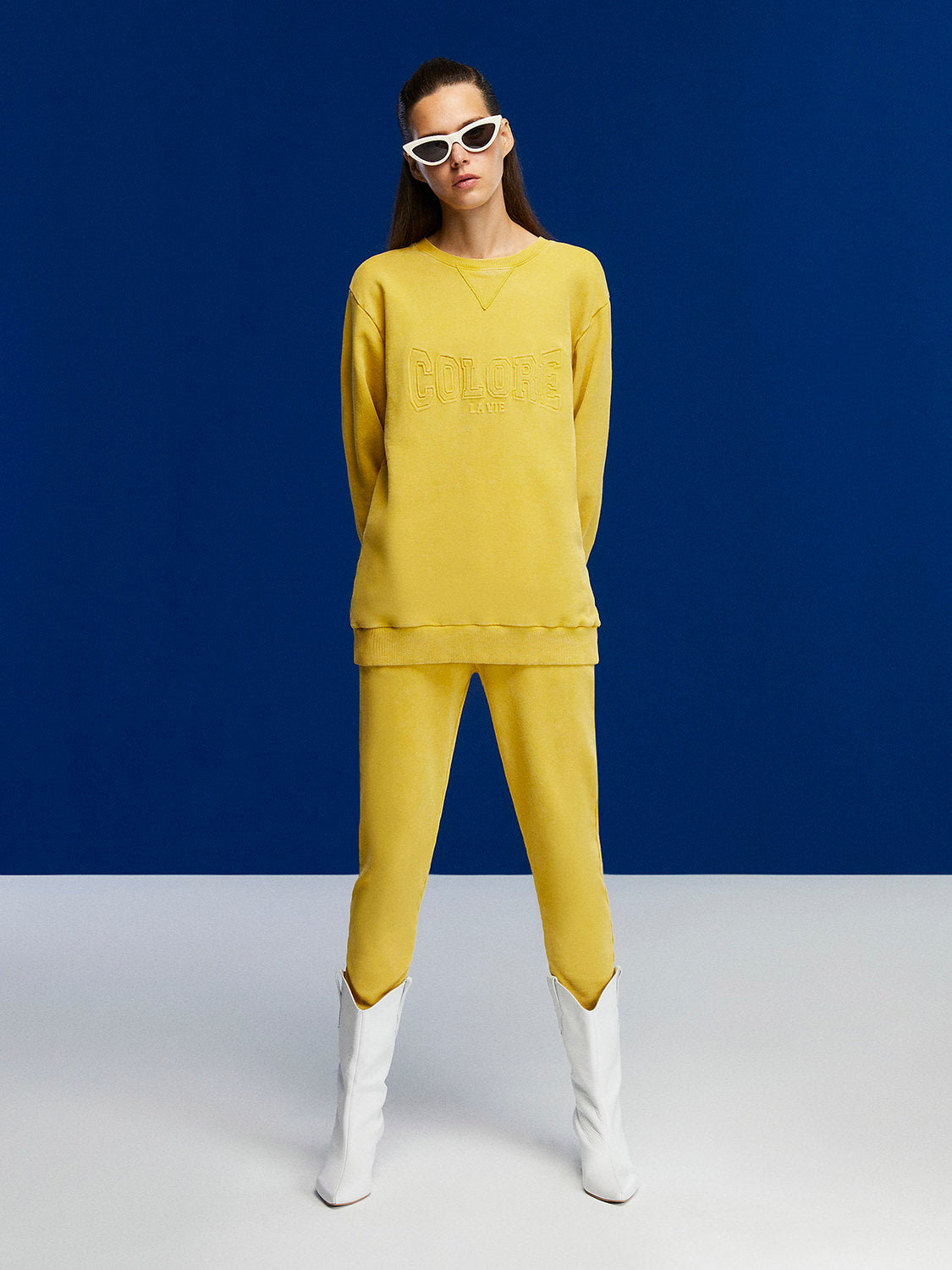 A cozy crew-neck oversized sweatshirt featuring a stylish front text print, perfect for casual wear.