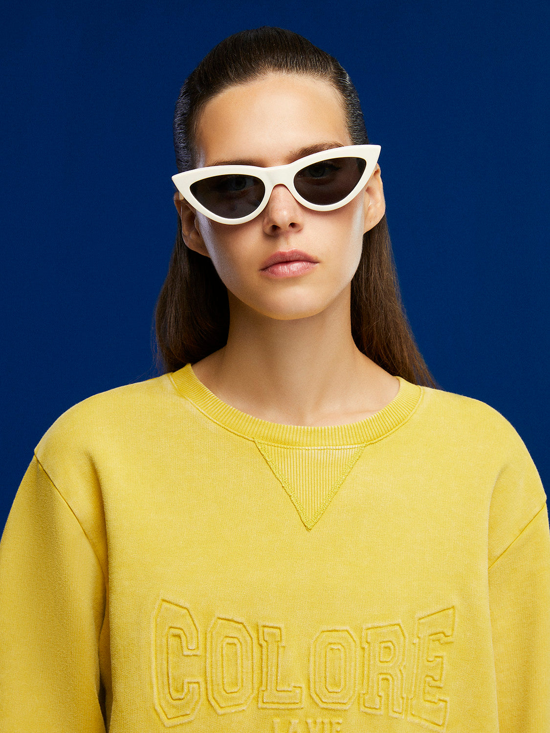 A cozy crew-neck oversized sweatshirt featuring a stylish front text print, perfect for casual wear.