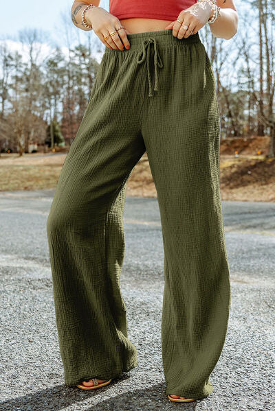 A pair of stylish Texture Tied Wide Leg Pants in a soft cotton fabric, featuring a tied waist design and a wide-leg silhouette.