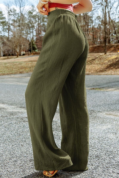 A pair of stylish Texture Tied Wide Leg Pants in a soft cotton fabric, featuring a tied waist design and a wide-leg silhouette.