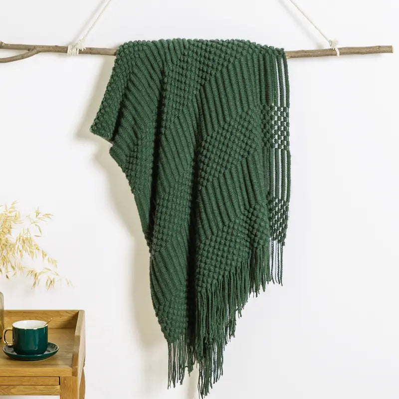 A soft, textured knit throw blanket in a cozy setting, perfect for snuggling.