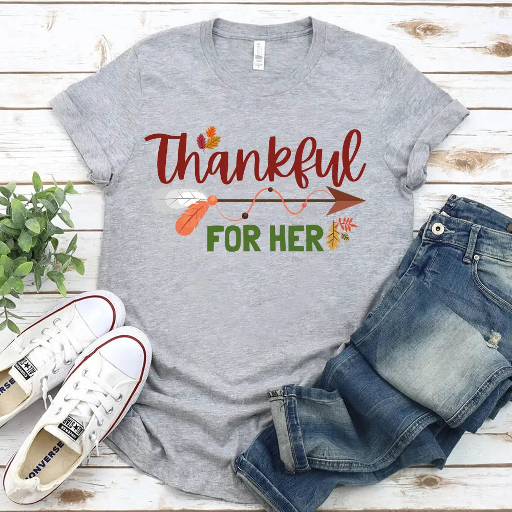 Thankful For Her/Him Thanksgiving Couple T-Shirt featuring a comfortable fit and festive design, perfect for couples celebrating Thanksgiving.