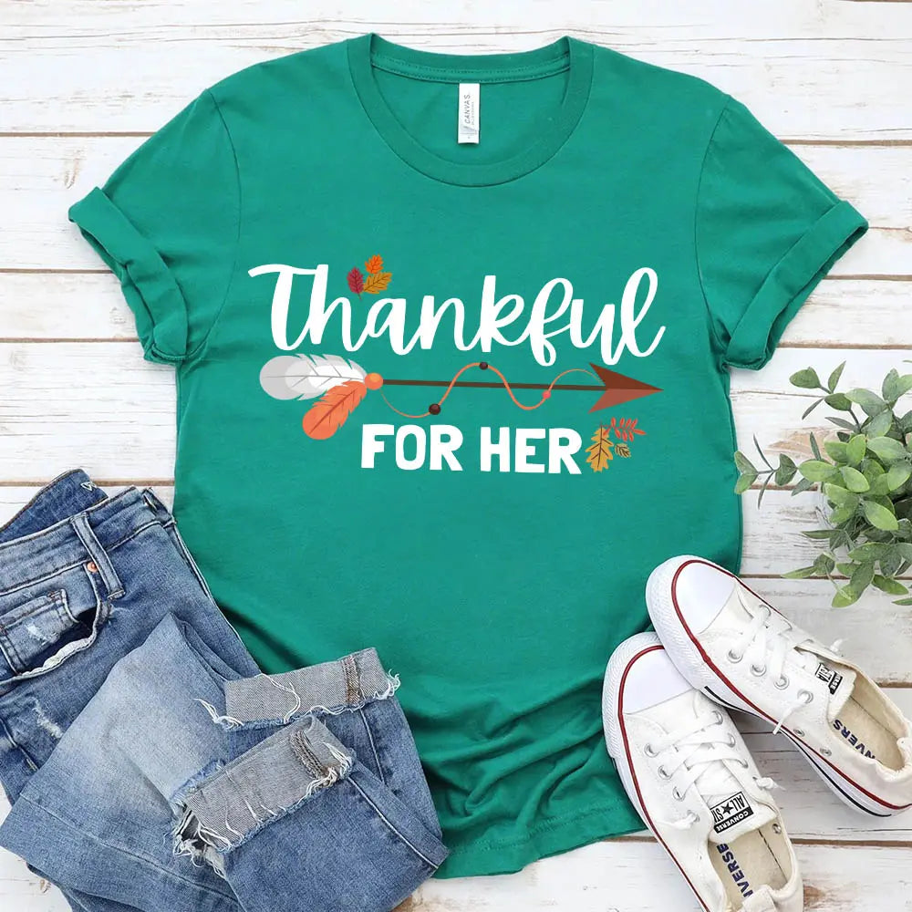 Thankful For Her/Him Thanksgiving Couple T-Shirt featuring a comfortable fit and festive design, perfect for couples celebrating Thanksgiving.